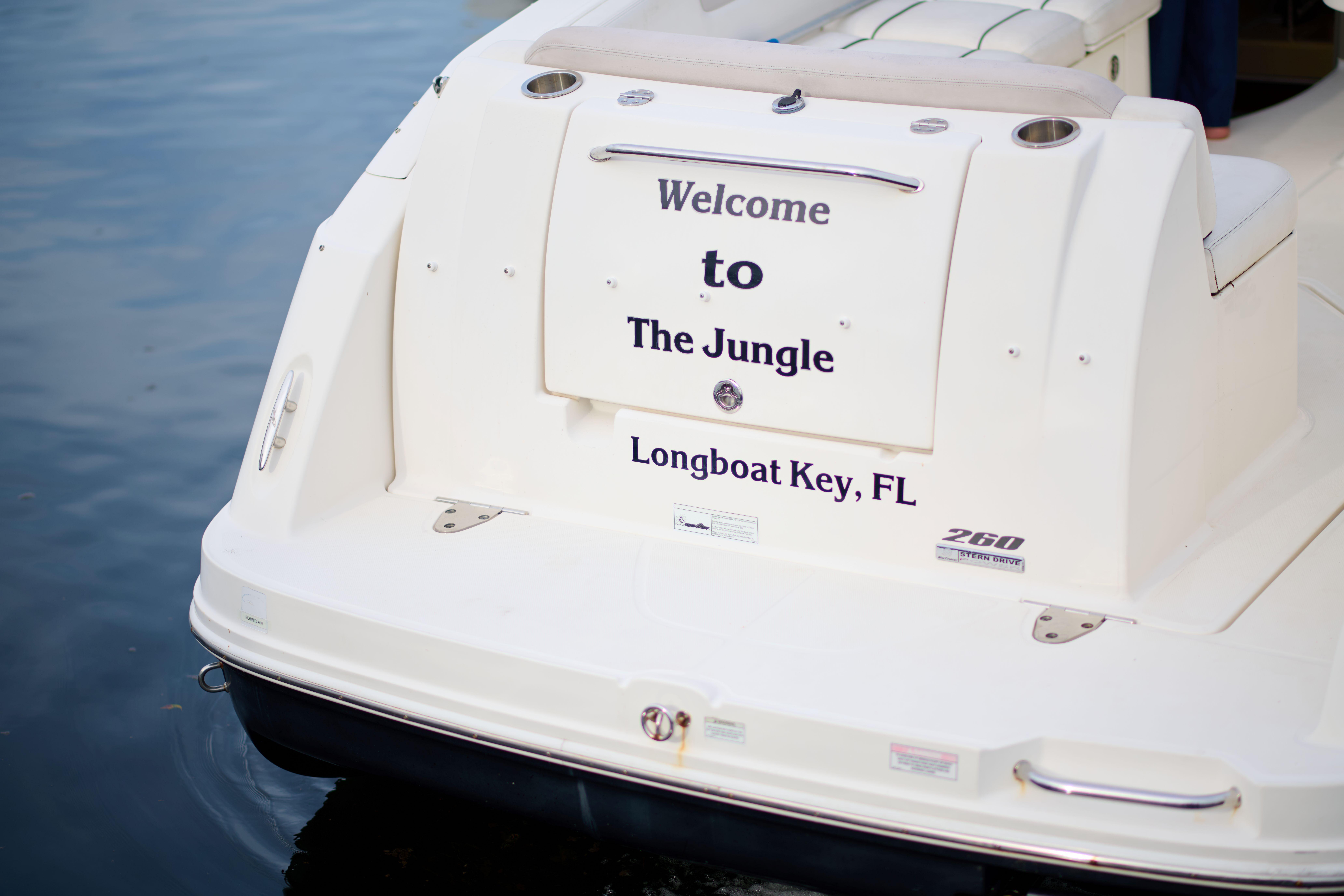 2011 Sea Ray 260 Sundancer boat with "Welcome to The Jungle" text, Longboat Key, FL.