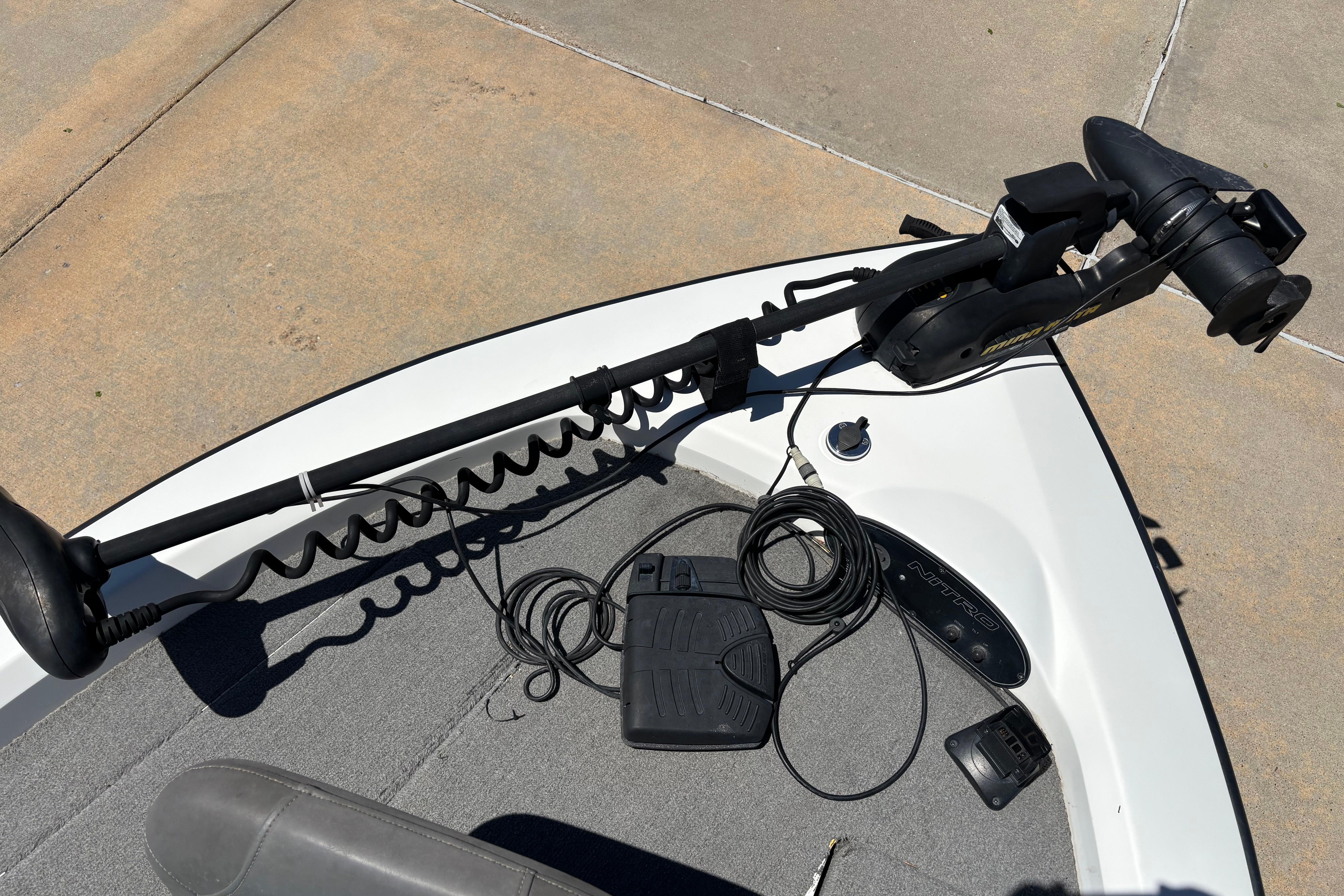 Bow of a 1998 Nitro 700 LX DC boat with trolling motor and foot pedal.