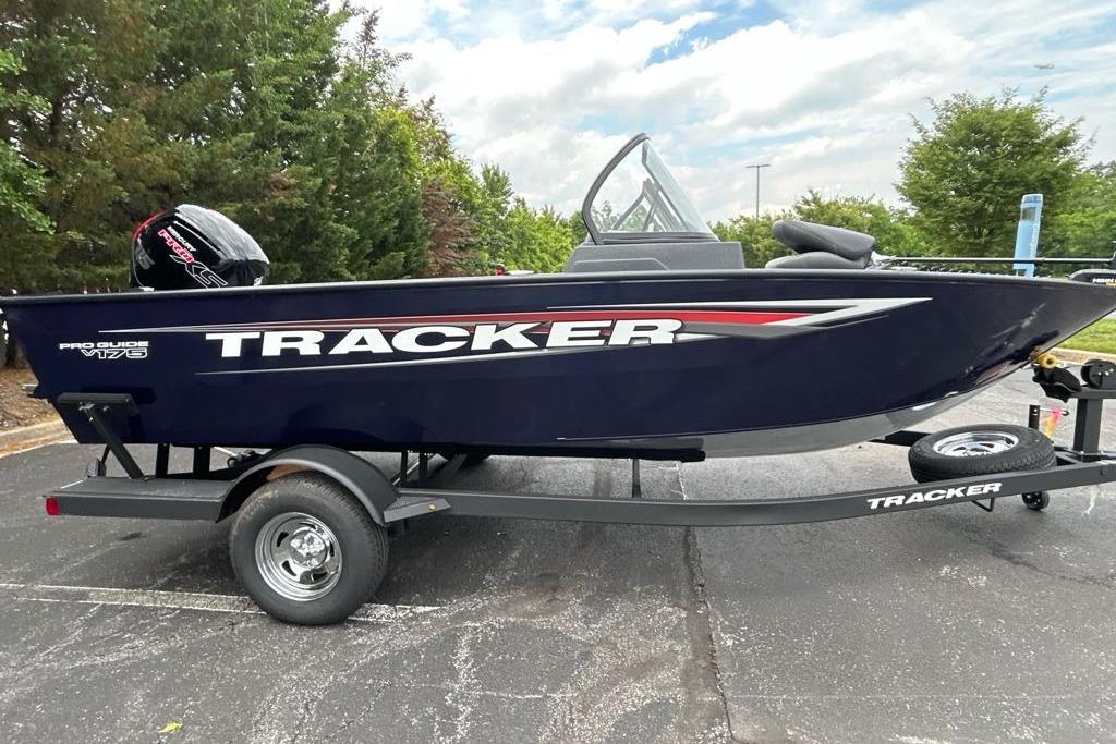 2025 Tracker Pro Guide V-175 WT boat on trailer, parked outdoors.