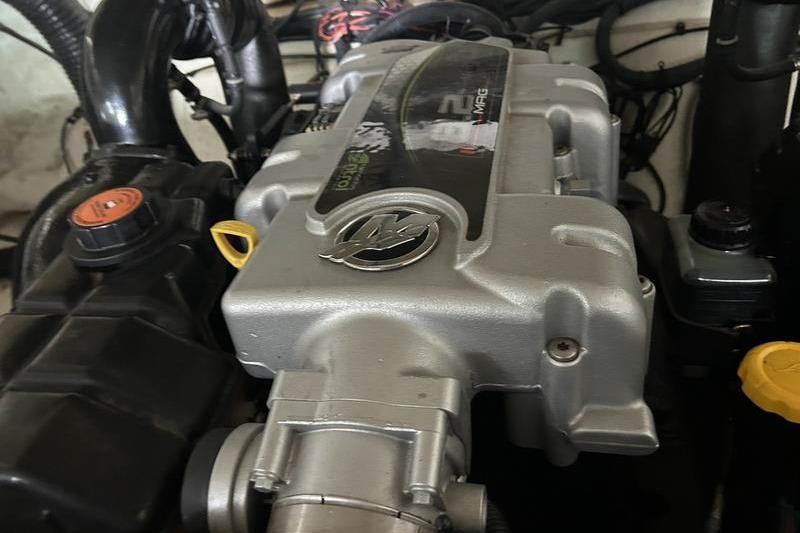 Engine of a 2011 Sea Ray 300 SLX boat, showcasing detailed components.