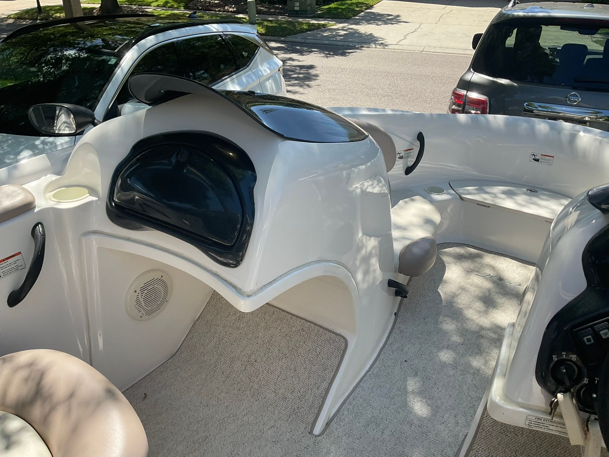 Interior of a 2000 Yamaha LS2000 boat, featuring seating area and helm console.