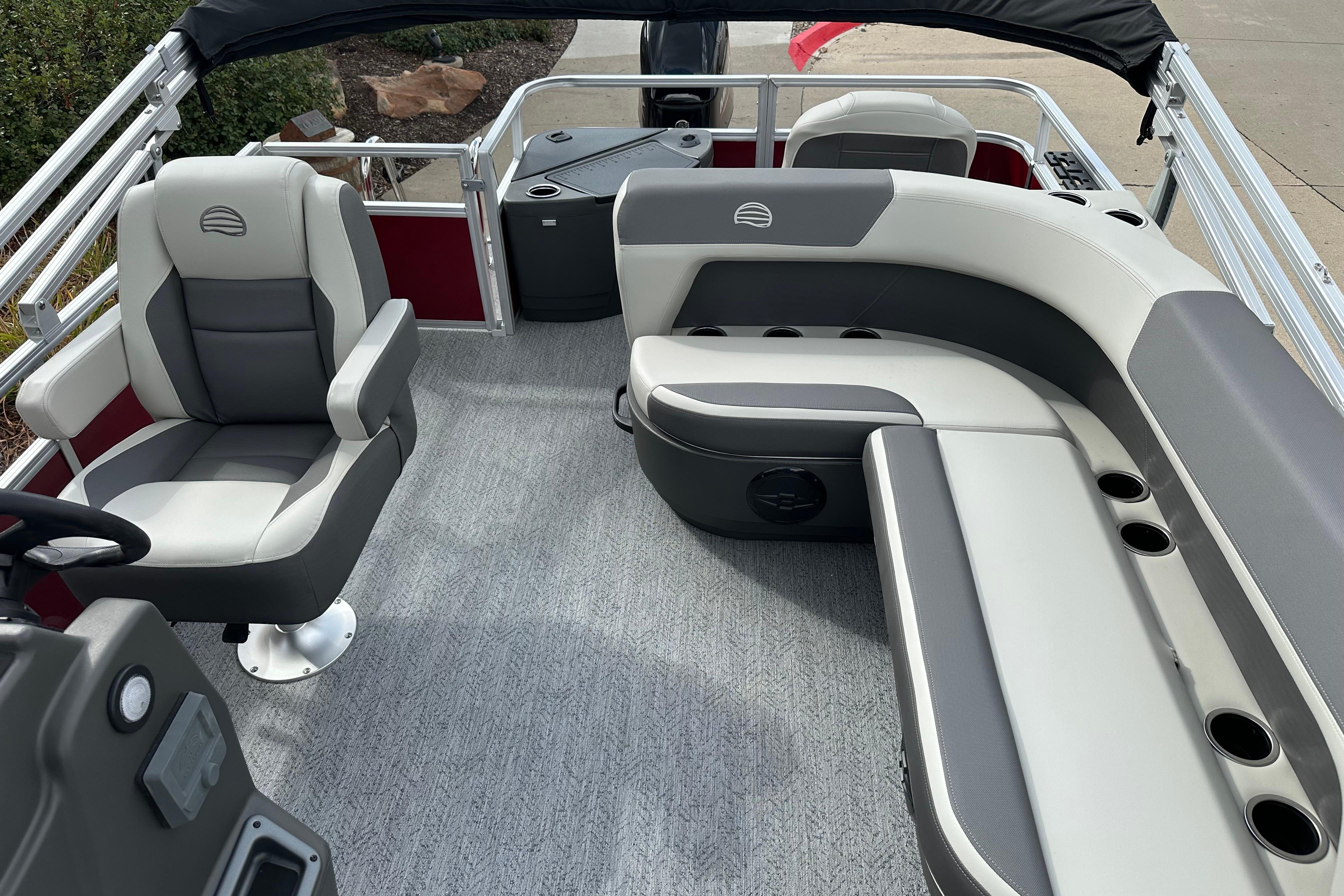 2026 Sun Tracker Bass Buggy 18 DLX interior with gray seating and modern design.