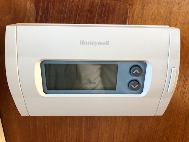 Honeywell thermostat on 1988 Bayliner 3818 Motoryacht wooden interior.