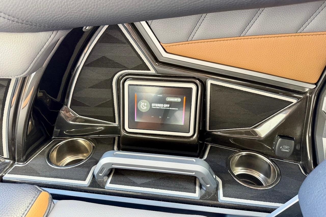 2025 Tigé Ultré 25ZX dashboard with touchscreen controls and cup holders.
