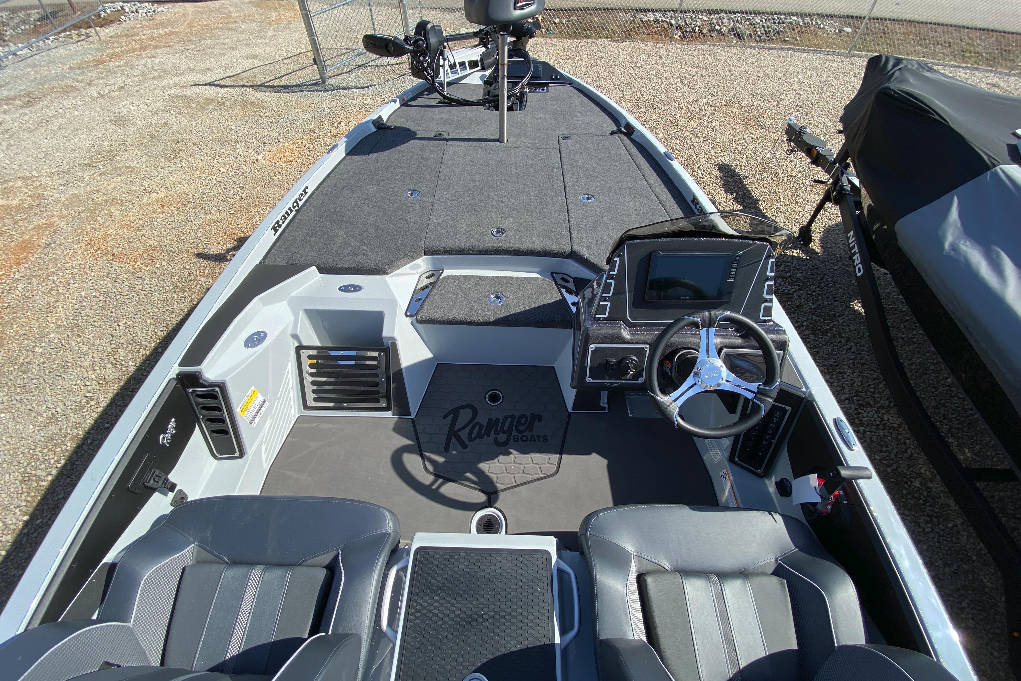2026 Ranger Z519R boat interior with steering wheel and seating, showcasing modern design.