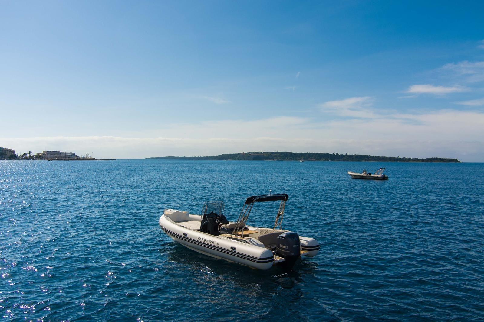 2020 Capelli Tempest 775 boat on calm blue sea under clear sky.