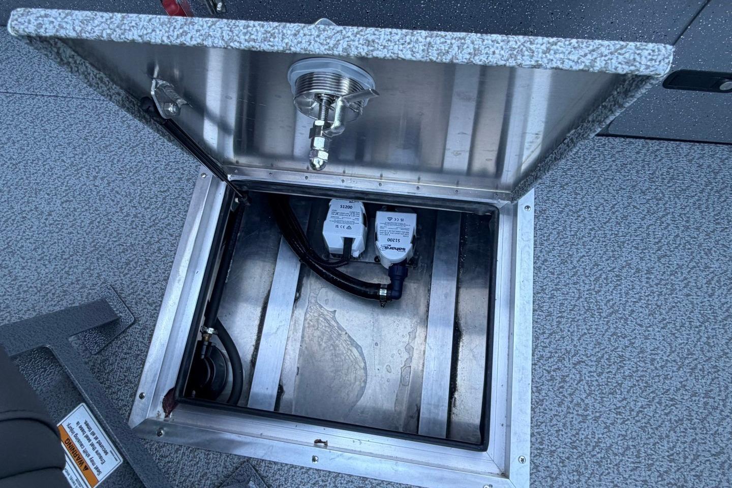 Open hatch of 2026 Thunder Jet 209 Rush OT boat, revealing internal components.