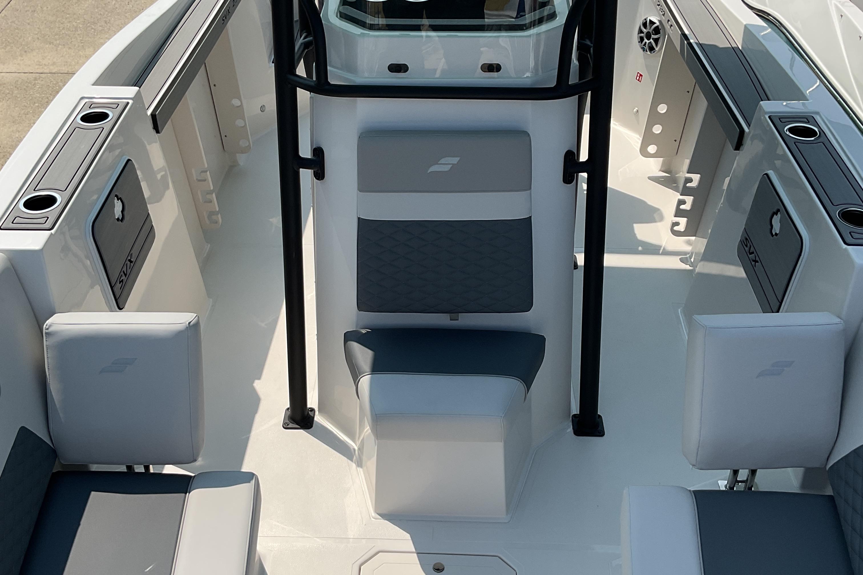 2026 Starcraft SVX 231 OB CC boat interior with seating and storage compartments.