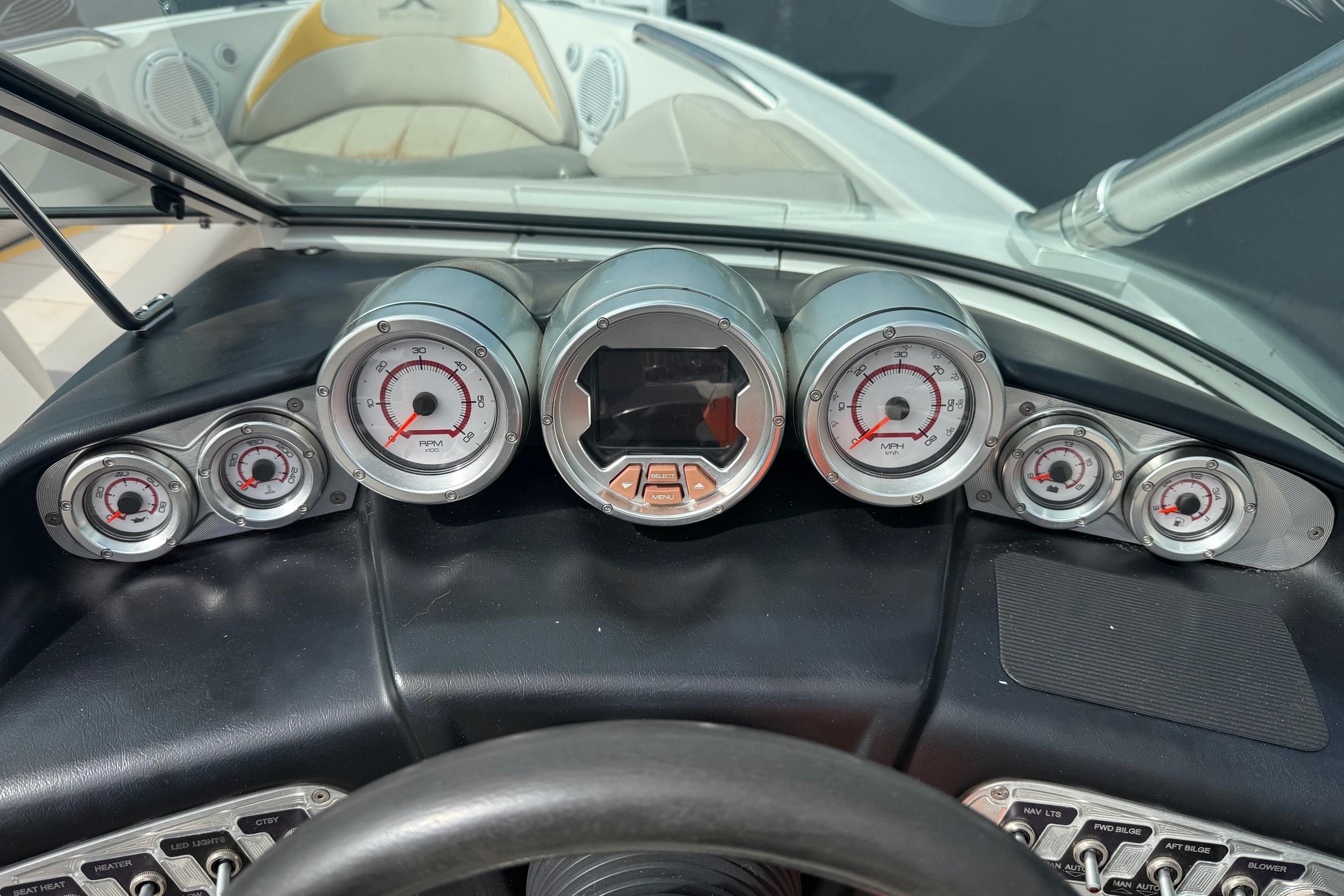 Dashboard of a 2008 MasterCraft X-15 boat with gauges and controls.