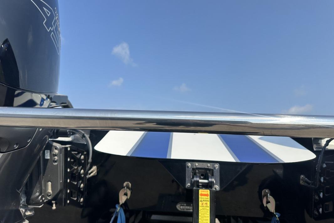 Rear view of a 2018 Wright Performance 420 boat with blue sky background.