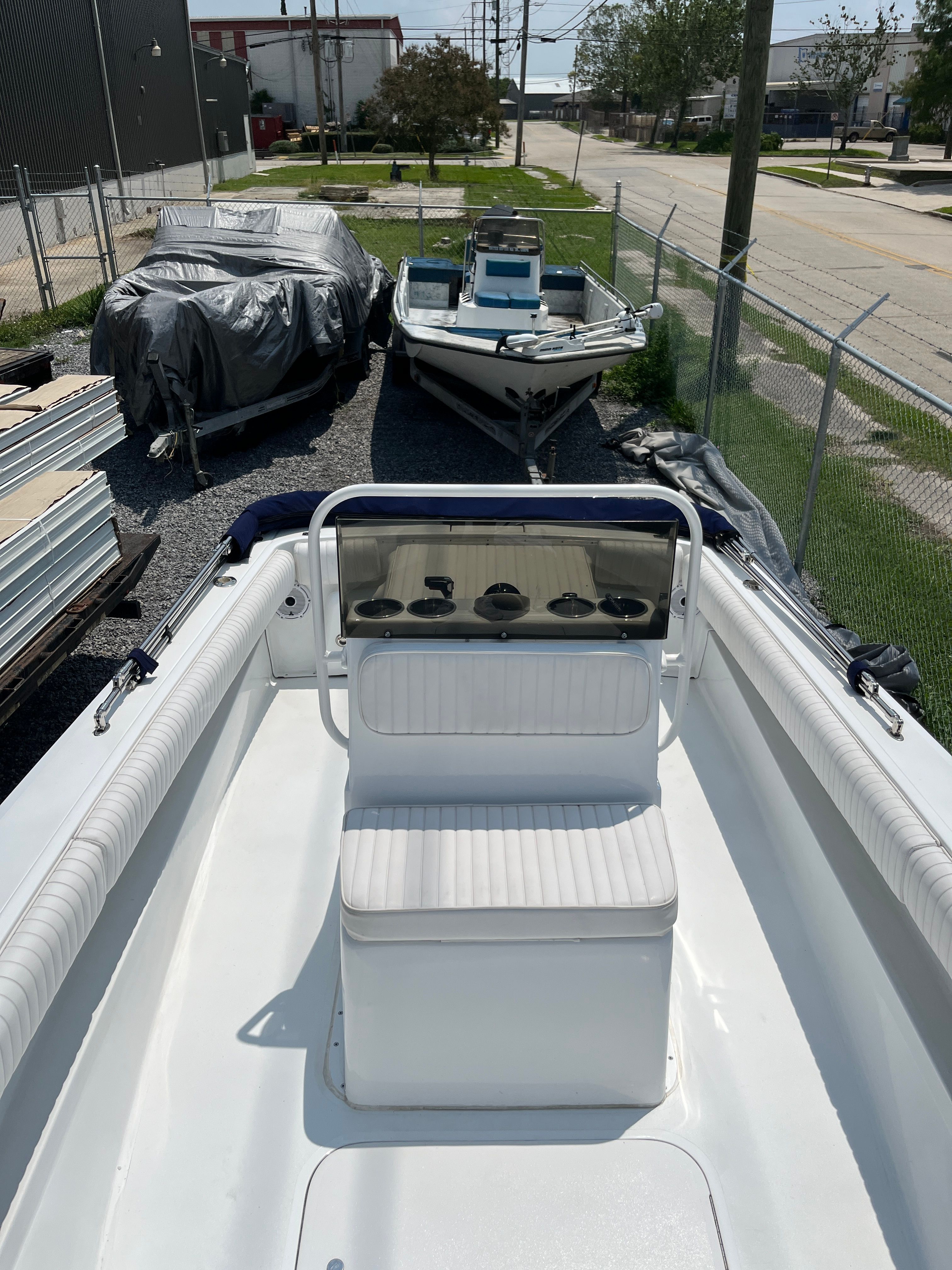 1970 Bertram Sportsman boat parked outdoors.