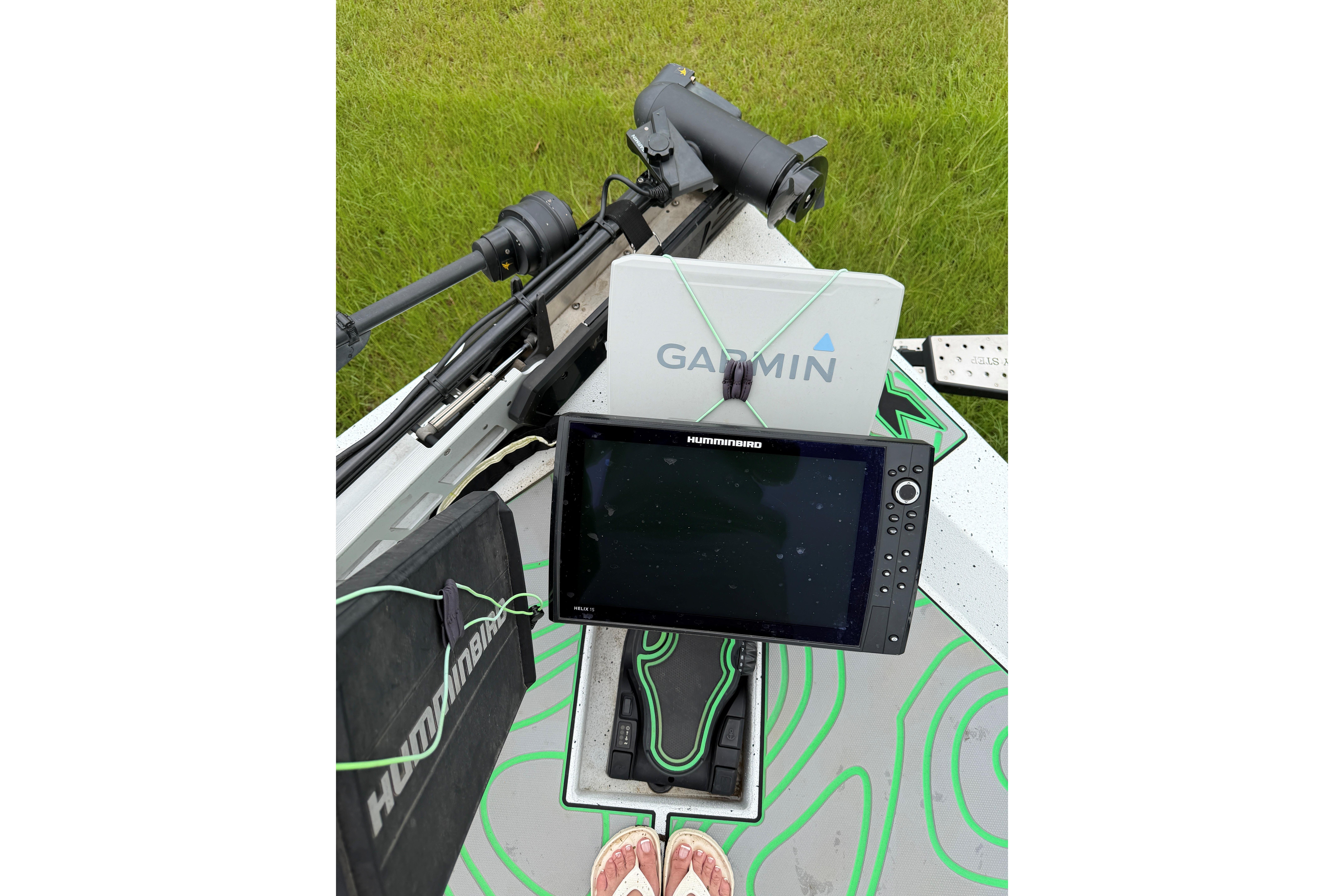Fishing boat electronics setup with Humminbird and Garmin devices on Xpress X21 Pro, 2022 model.