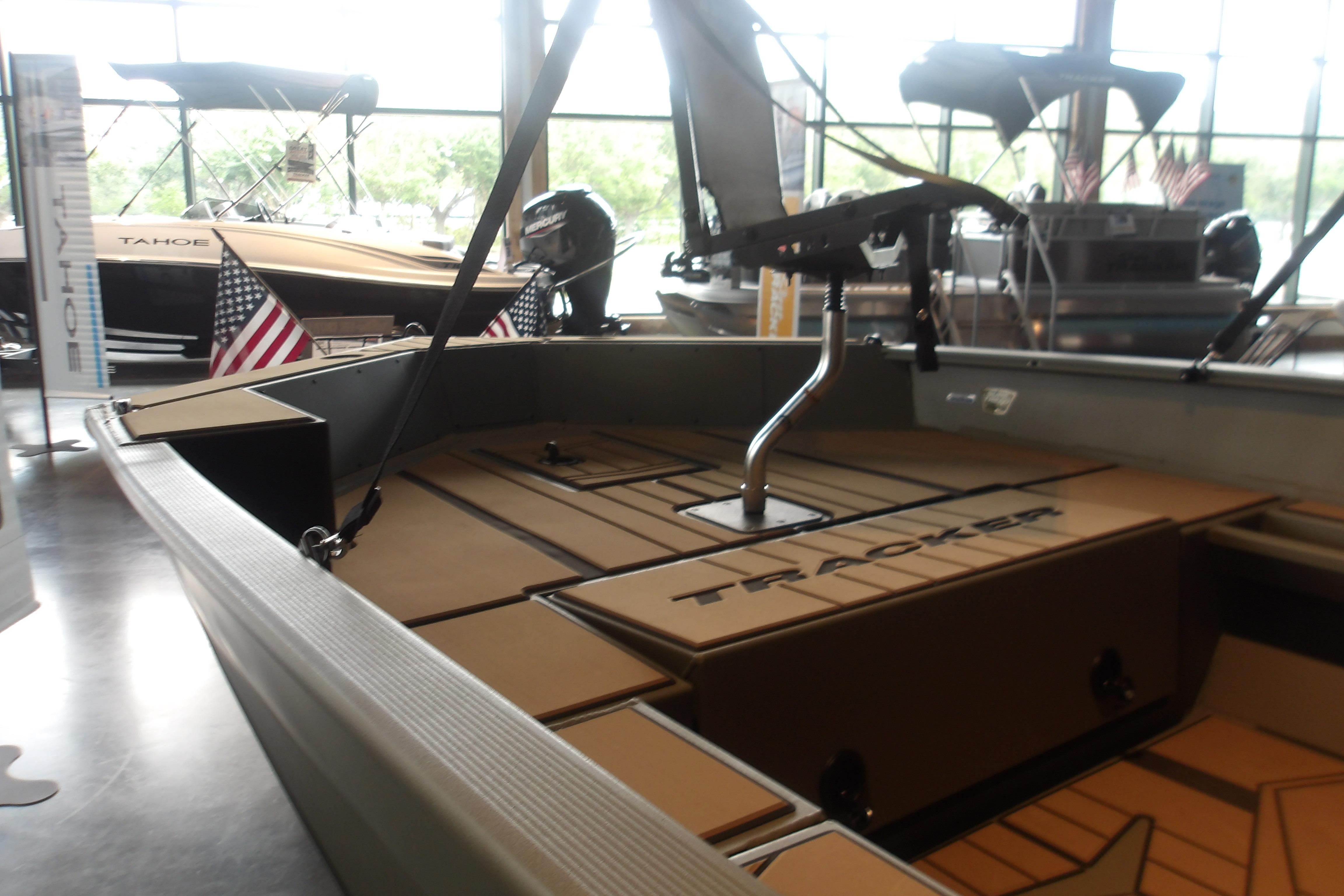 2026 Tracker Grizzly 1756 T Marsh boat interior with American flags displayed.