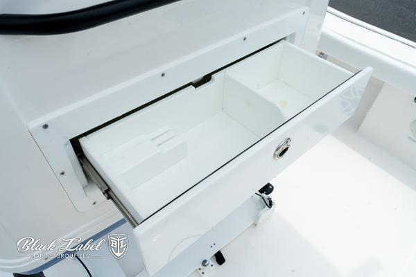 Open storage compartment on 2025 Caymas 281 HB boat.