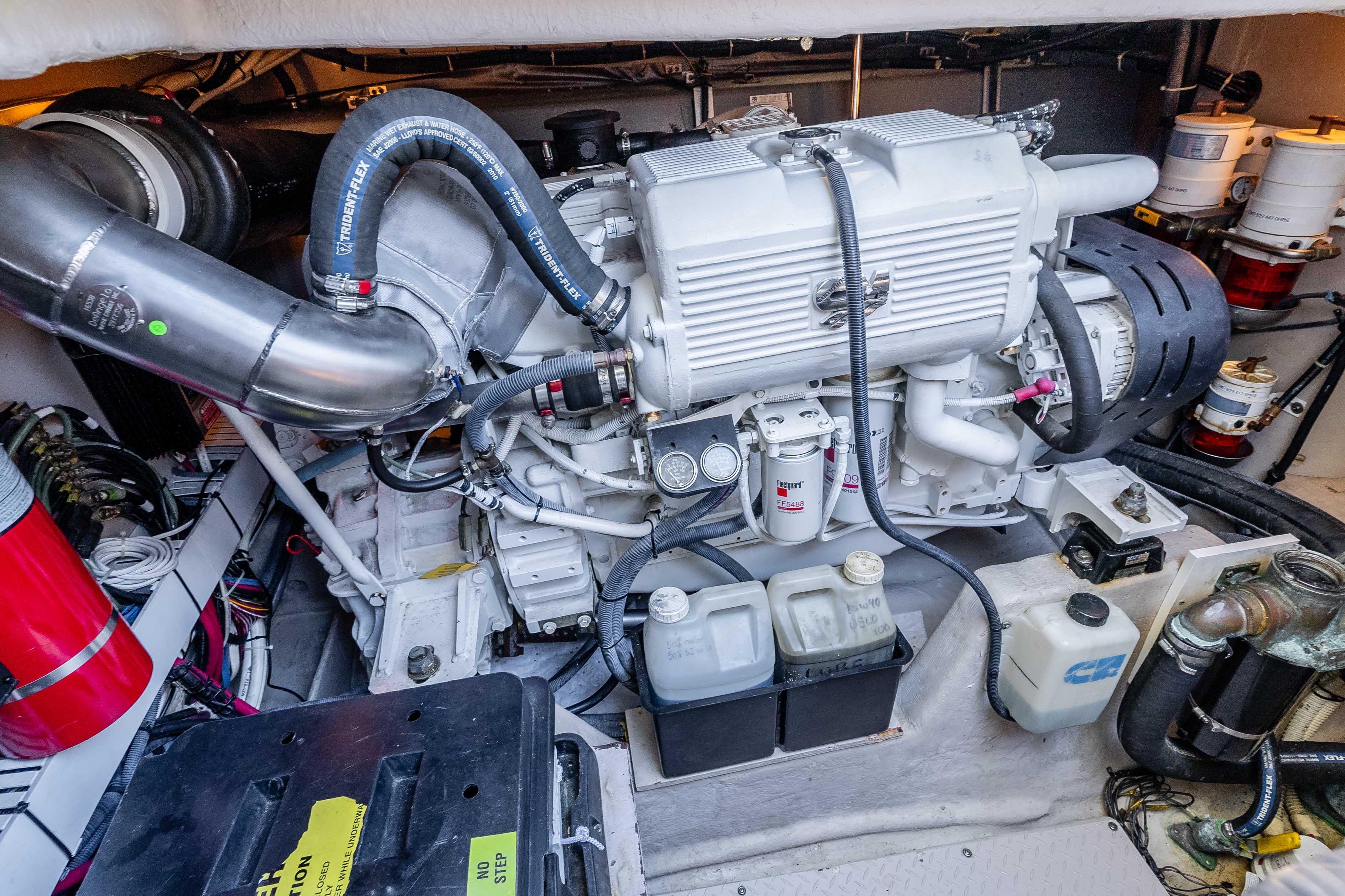 Engine room of a 2007 Sea Ray 48 Sundancer, showcasing detailed mechanical components.