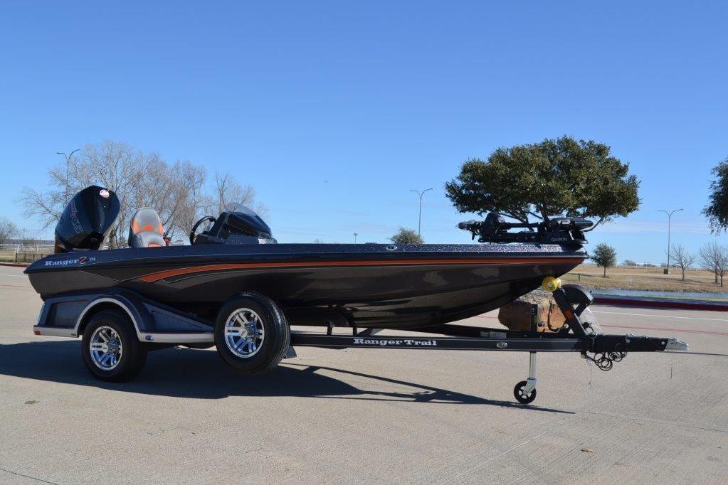 2025 Ranger Z518 Cup-Equipped boat on trailer, parked outdoors under clear blue sky.