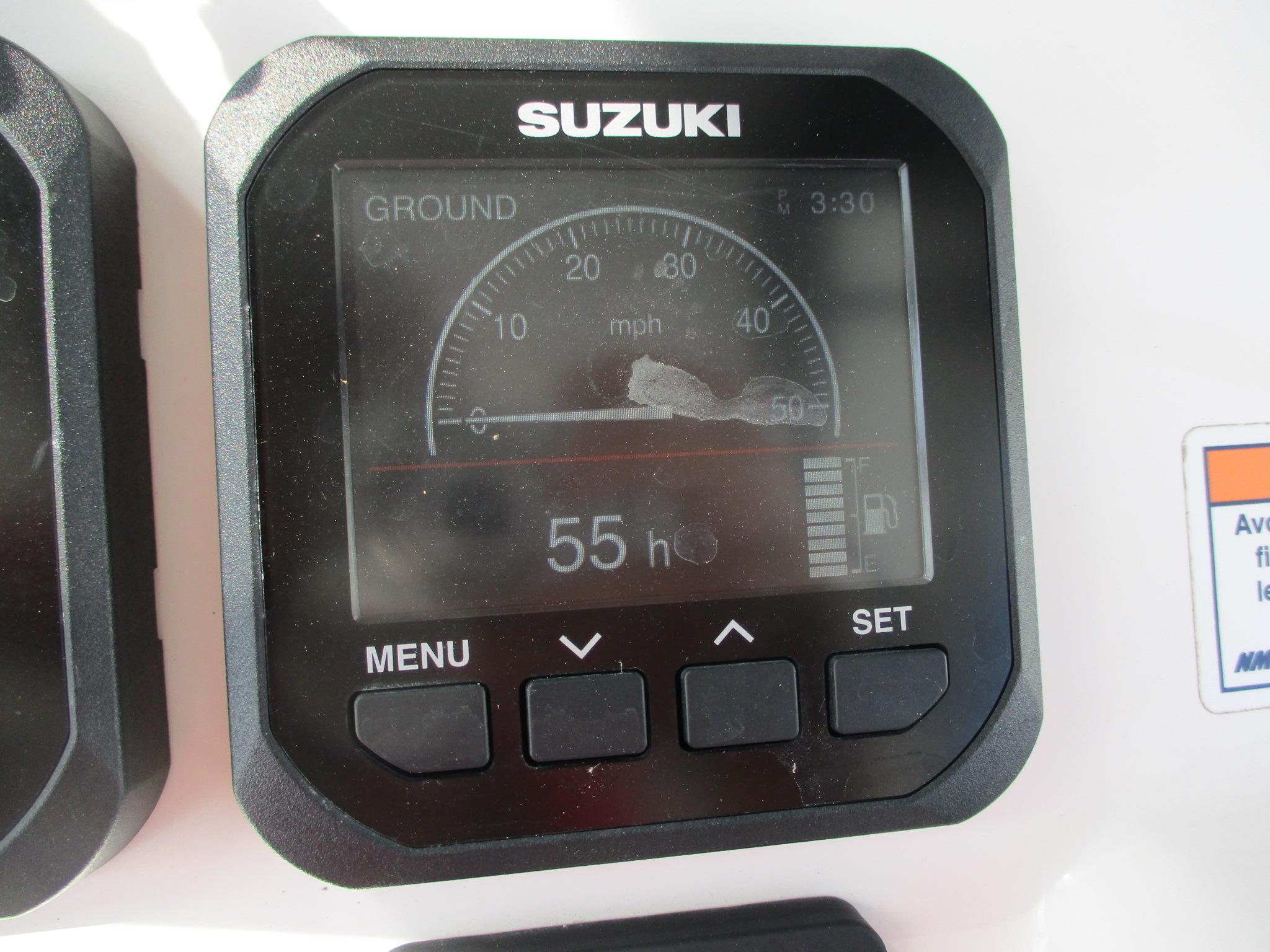 Suzuki digital gauge display on 2024 Blue Wave 2800 Makaira boat dashboard.