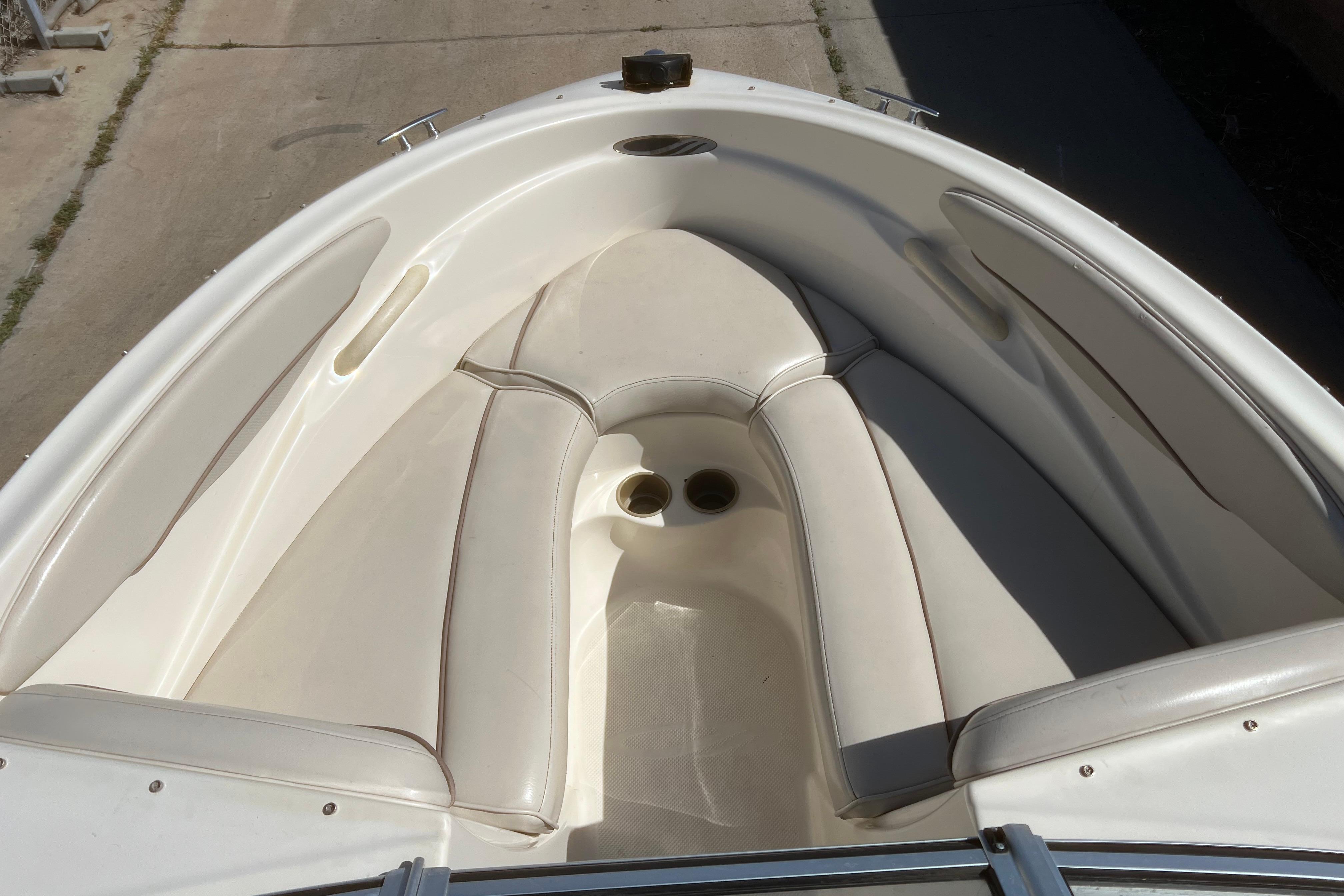 2002 Maxum 1800 SR boat interior with white cushioned seating.