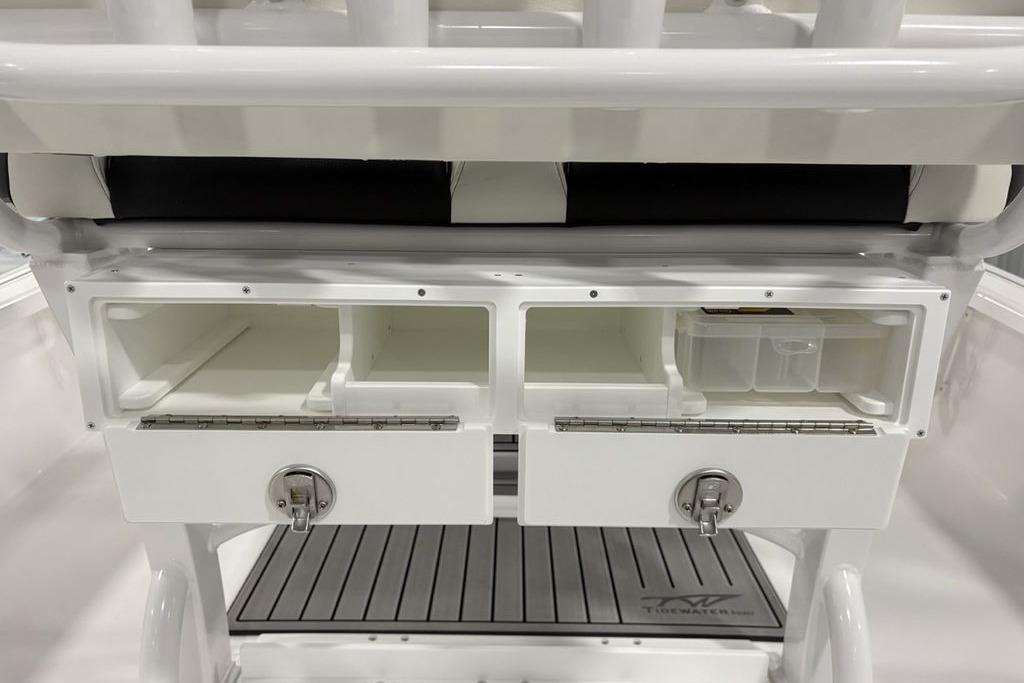 2026 Tidewater 2210 Carolina Bay boat storage compartments with secure latches and organized interior.