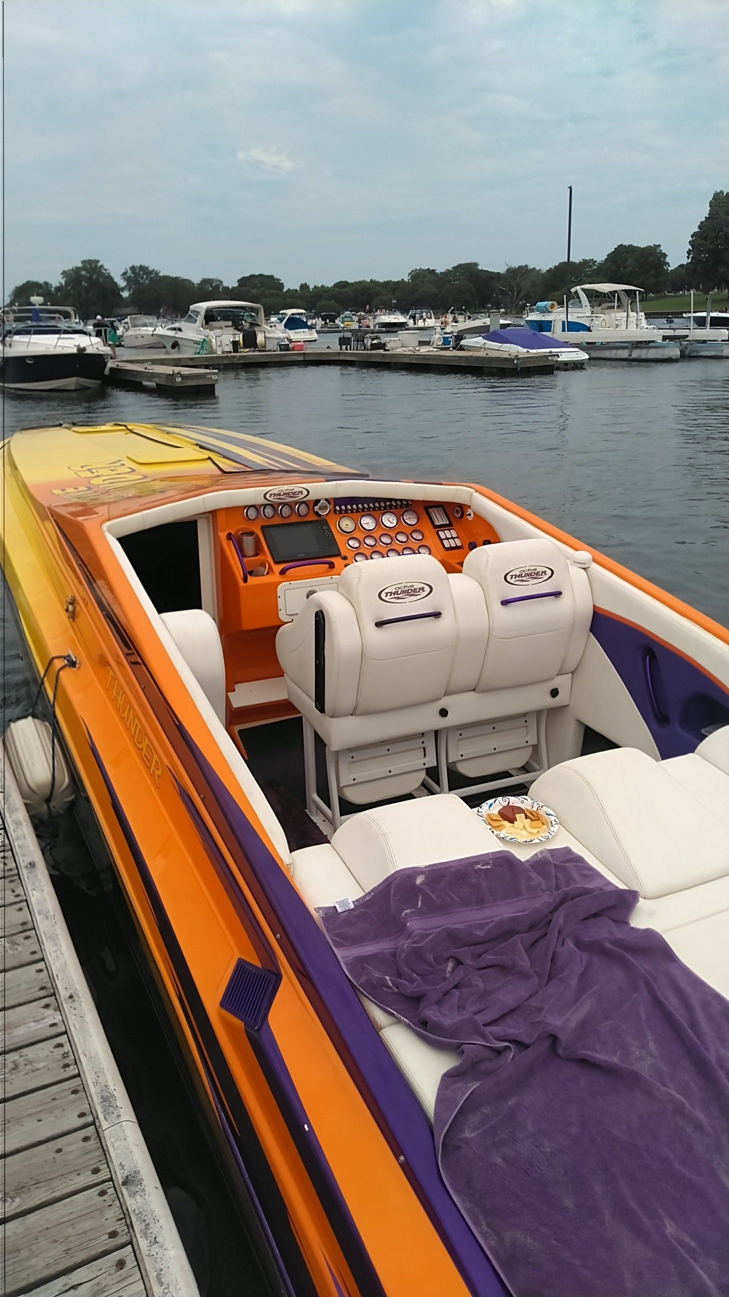 2006 Active Thunder Offshore boat docked at marina.