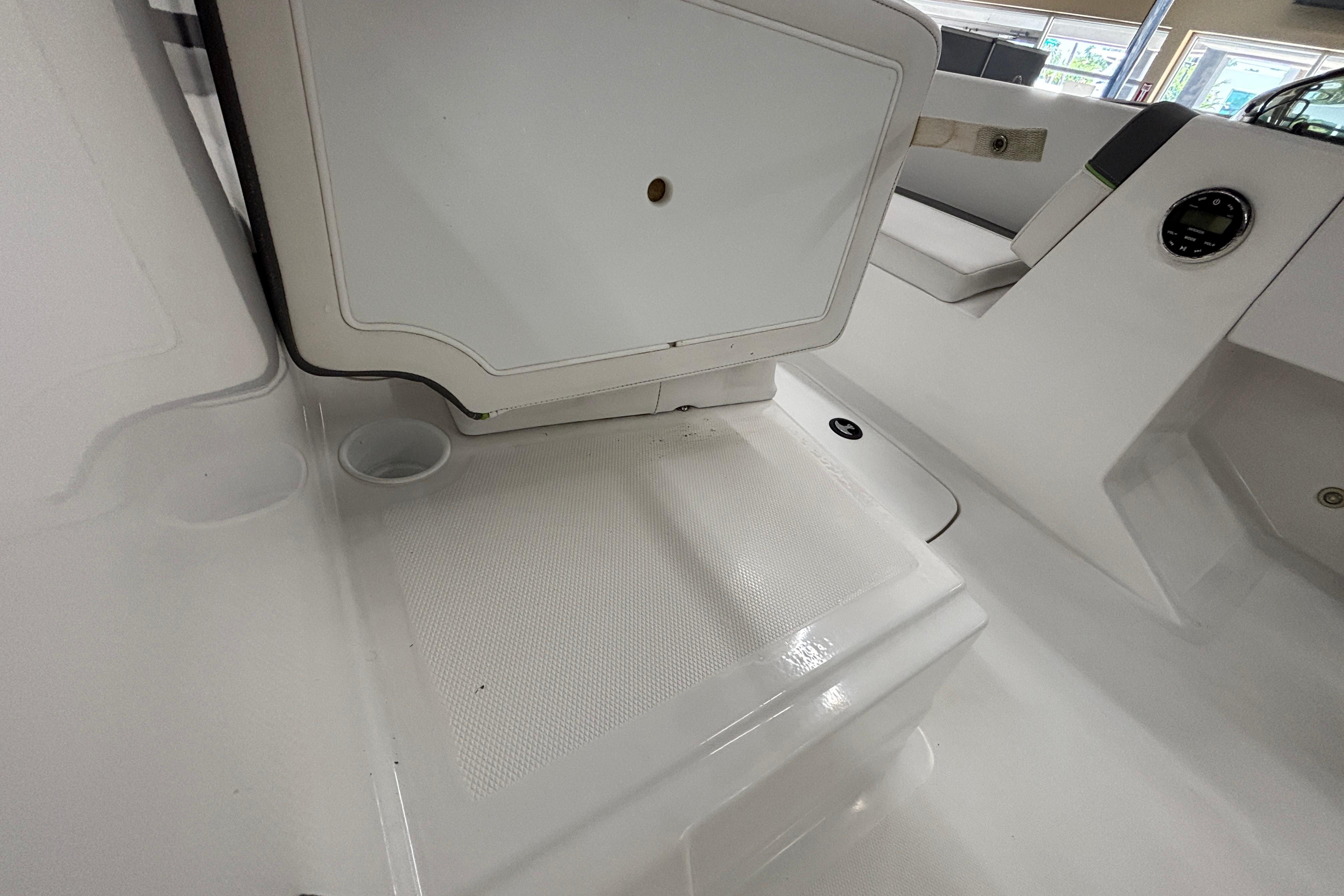 2024 Tahoe T18 boat interior with seating and storage compartments.