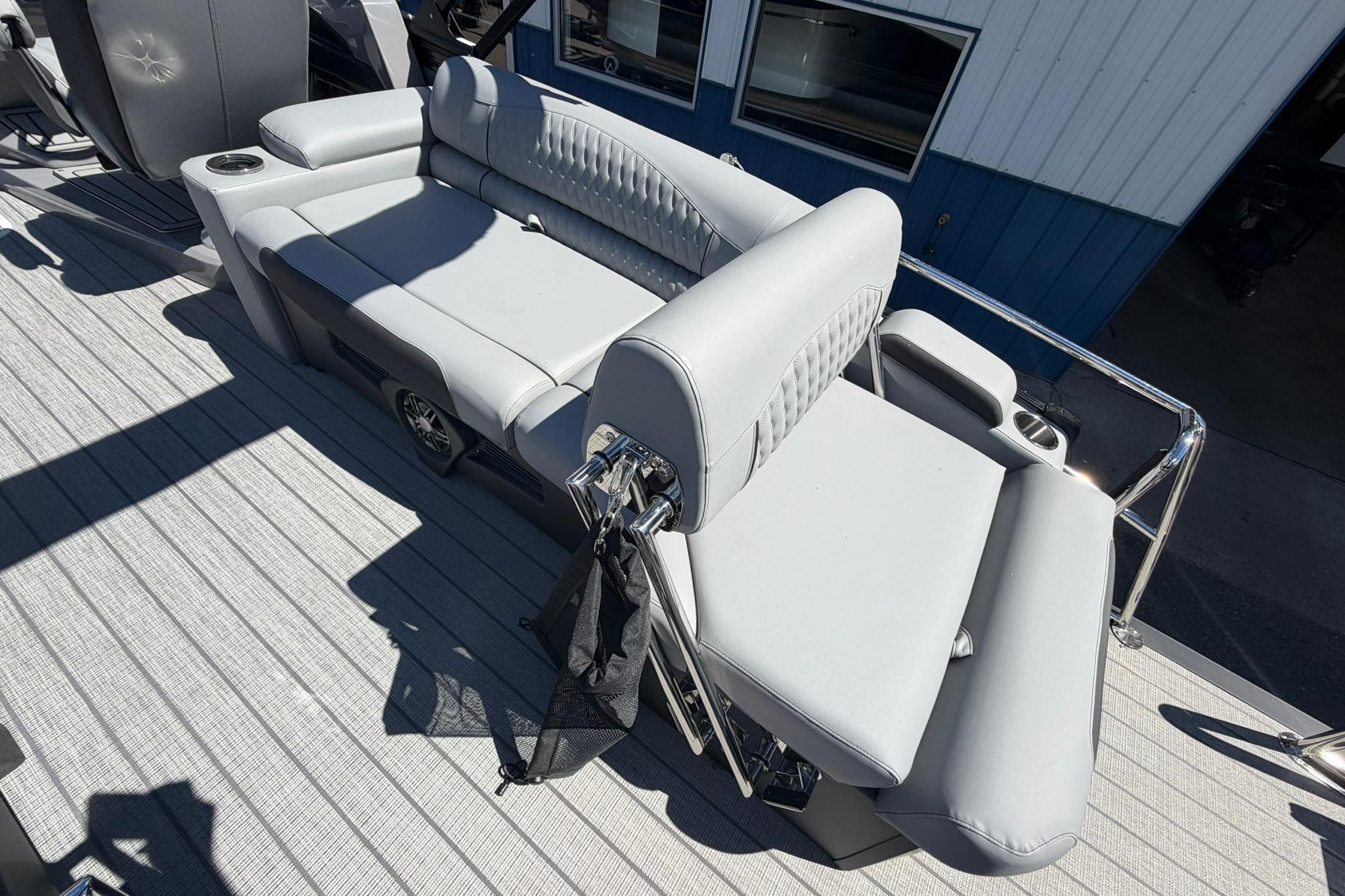Luxurious seating on 2026 Avalon Catalina Quad Lounge Shift boat, featuring sleek gray upholstery.