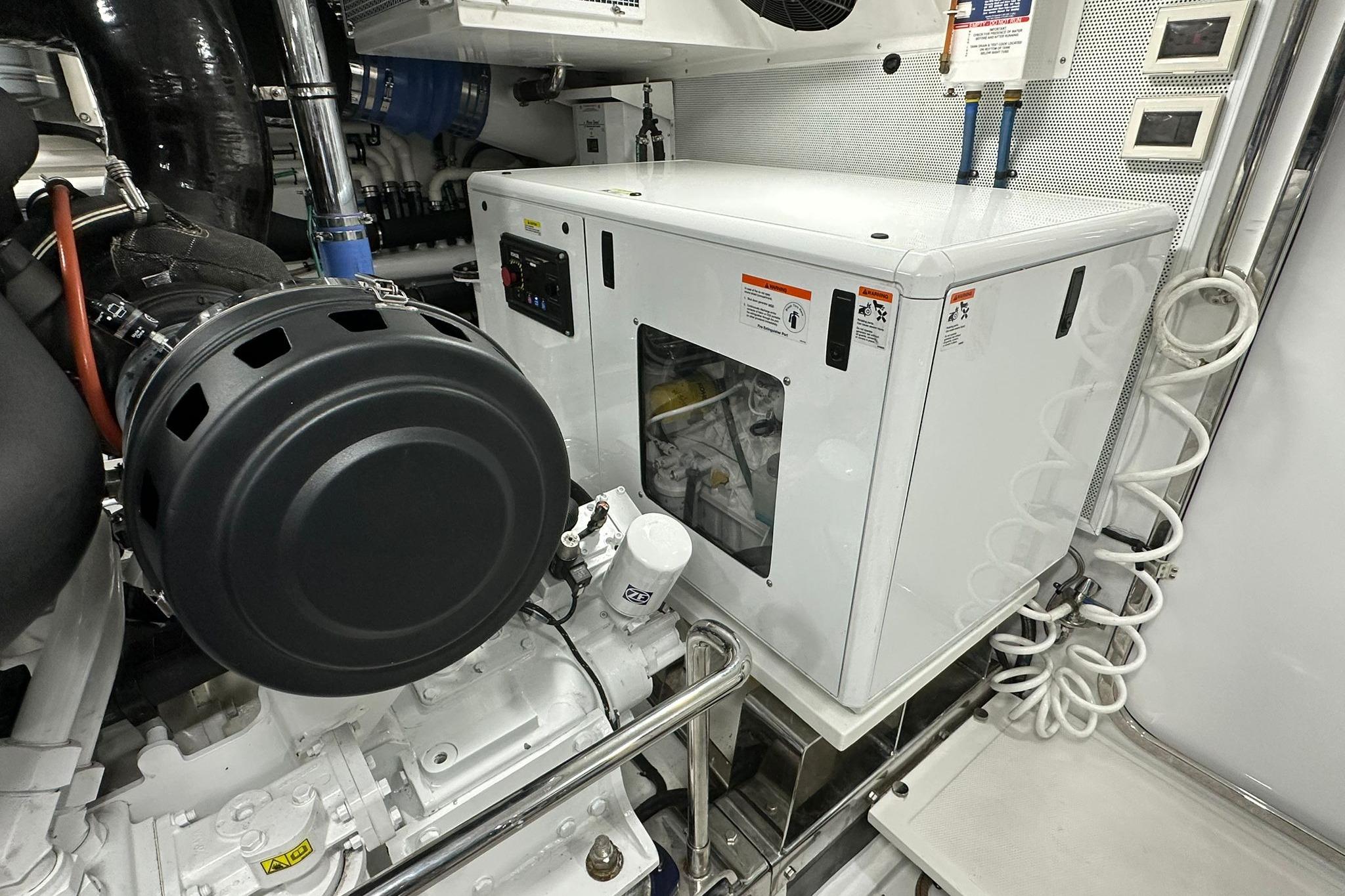 Engine room of 2023 Marlow Explorer 66E-CB yacht, featuring advanced machinery and equipment.