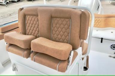 Luxurious seating on 2026 Sea Hunt Ultra 255 SE boat with tan upholstery.
