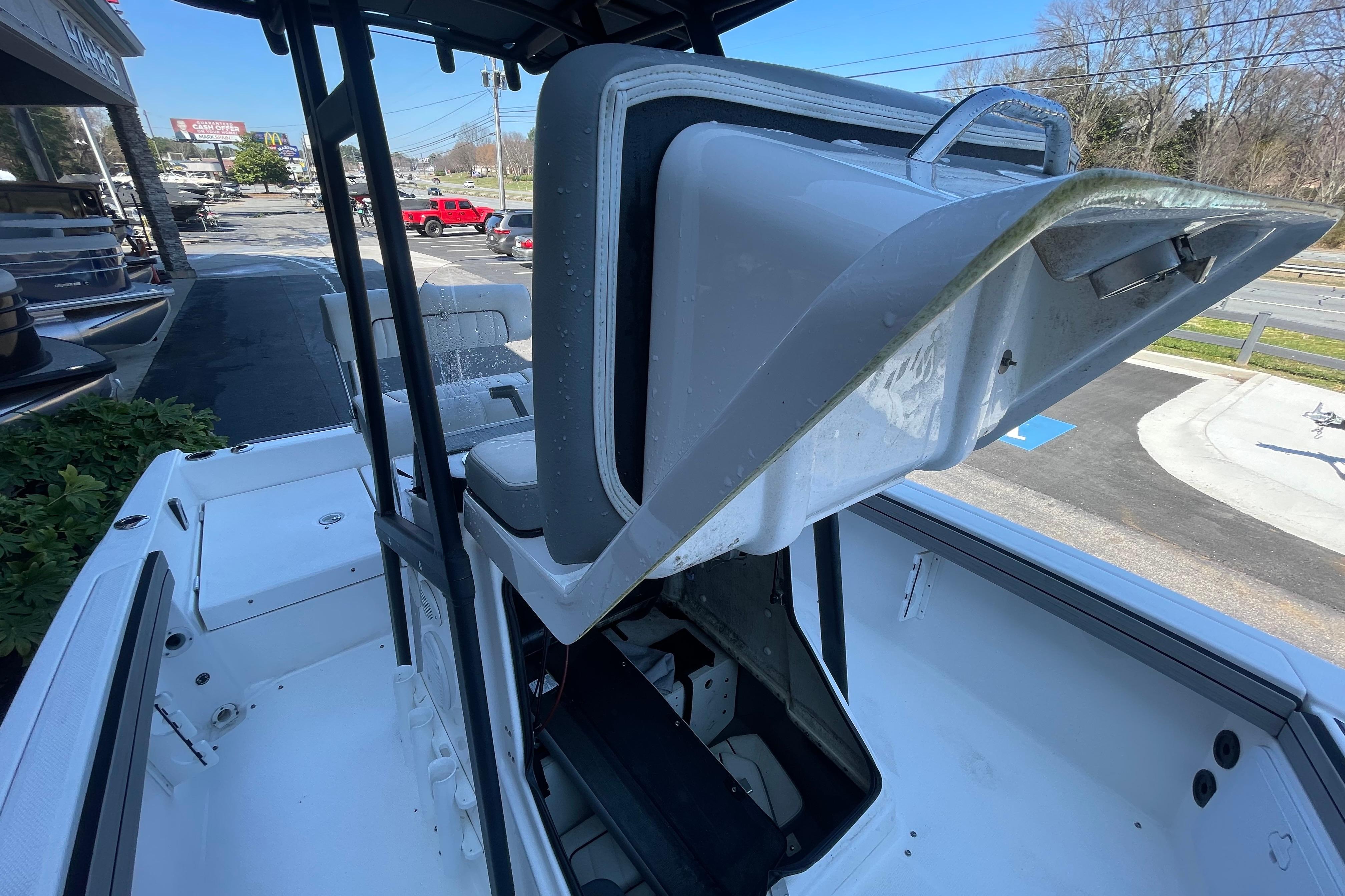 2021 Yamaha Boats 195 FSH Sport interior with open storage compartment.