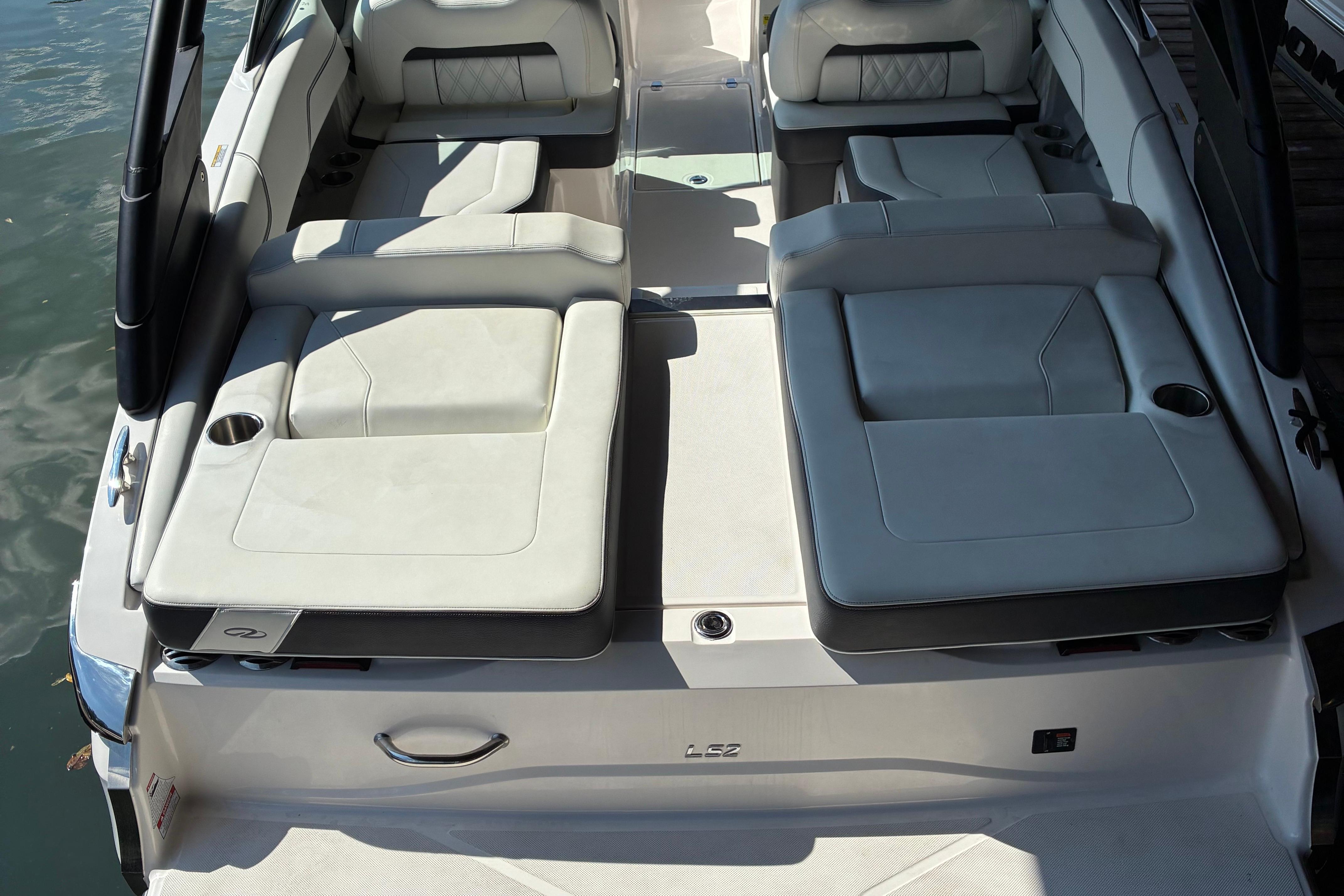 2025 Regal LS2 boat interior with luxurious seating and cup holders on the water.