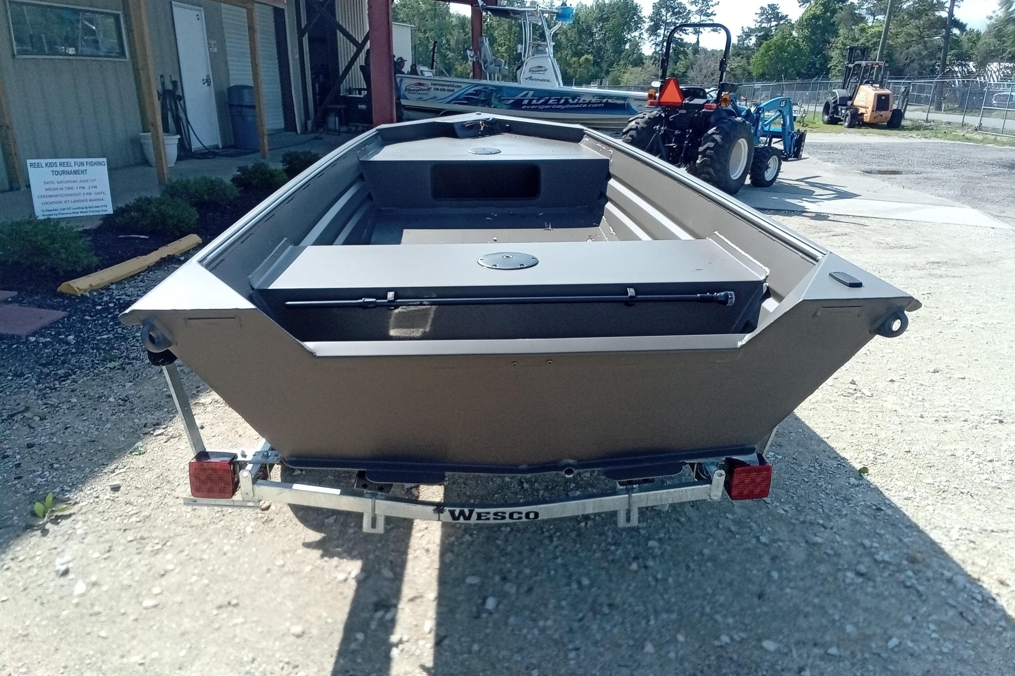 2026 Alweld 1448VV Vee Bottom boat on Wesco trailer, parked outdoors.