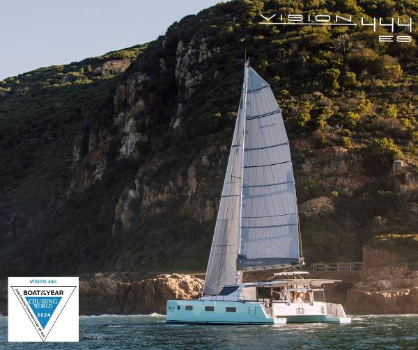 Vision 444 ES sailboat cruising near rocky coastline, awarded Boat of the Year 2024.