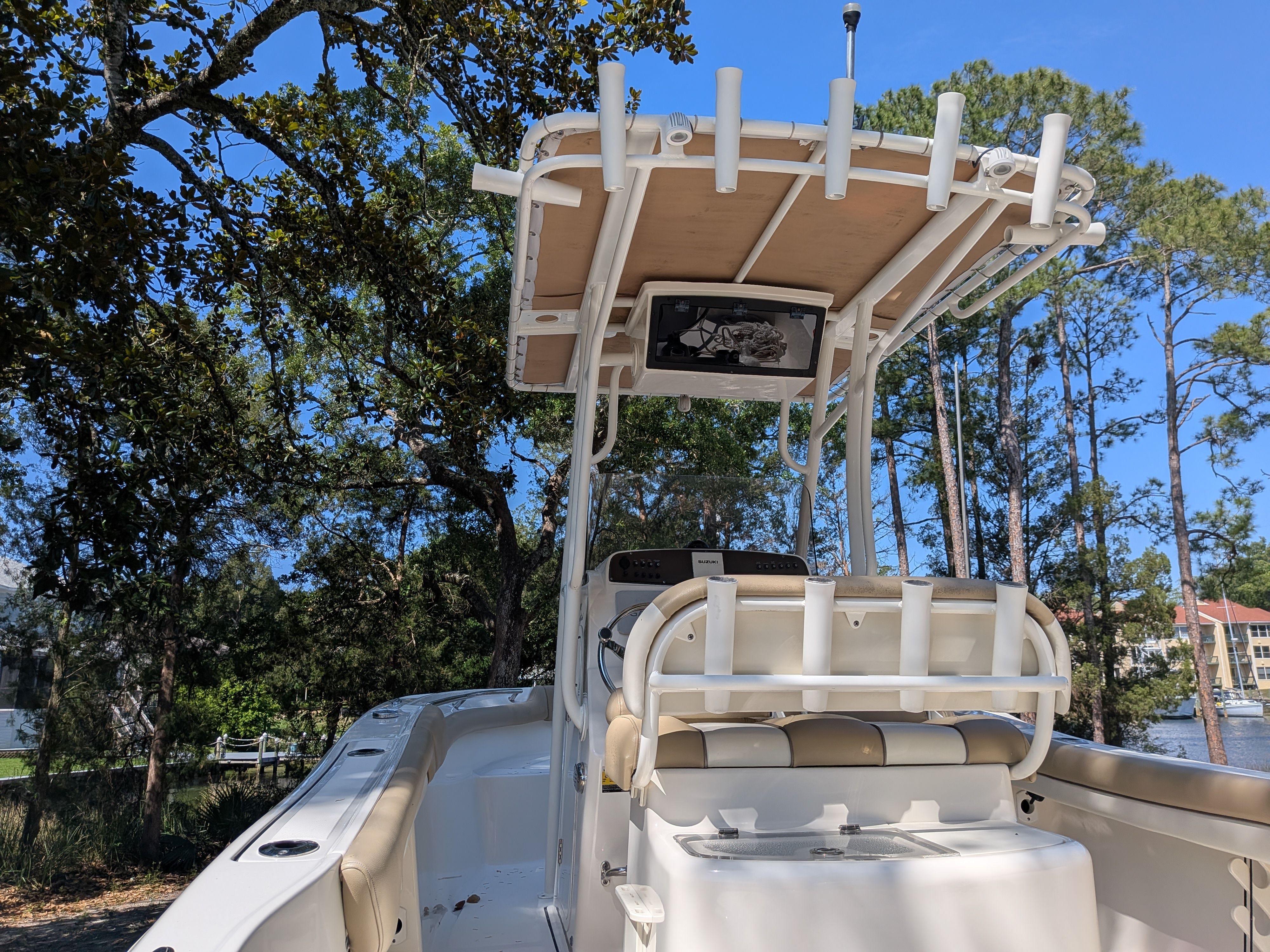 2020 Pioneer 202 Sportfish boat with T-top and seating area.