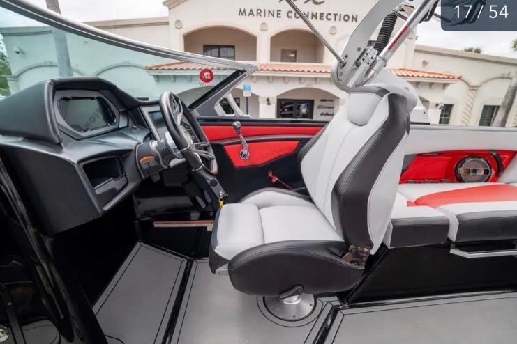 2019 MasterCraft XStar boat interior with modern dashboard and seating.