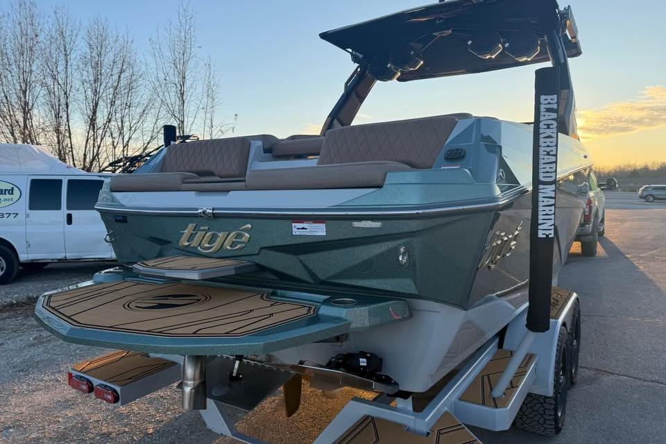 2026 Tigé Z3 boat on trailer at sunset, featuring sleek design and modern features.