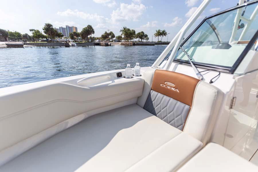 Manufacturer Provided Image: 2026 Cobia 240 Dual Console boat interior with luxurious seating and waterfront view.