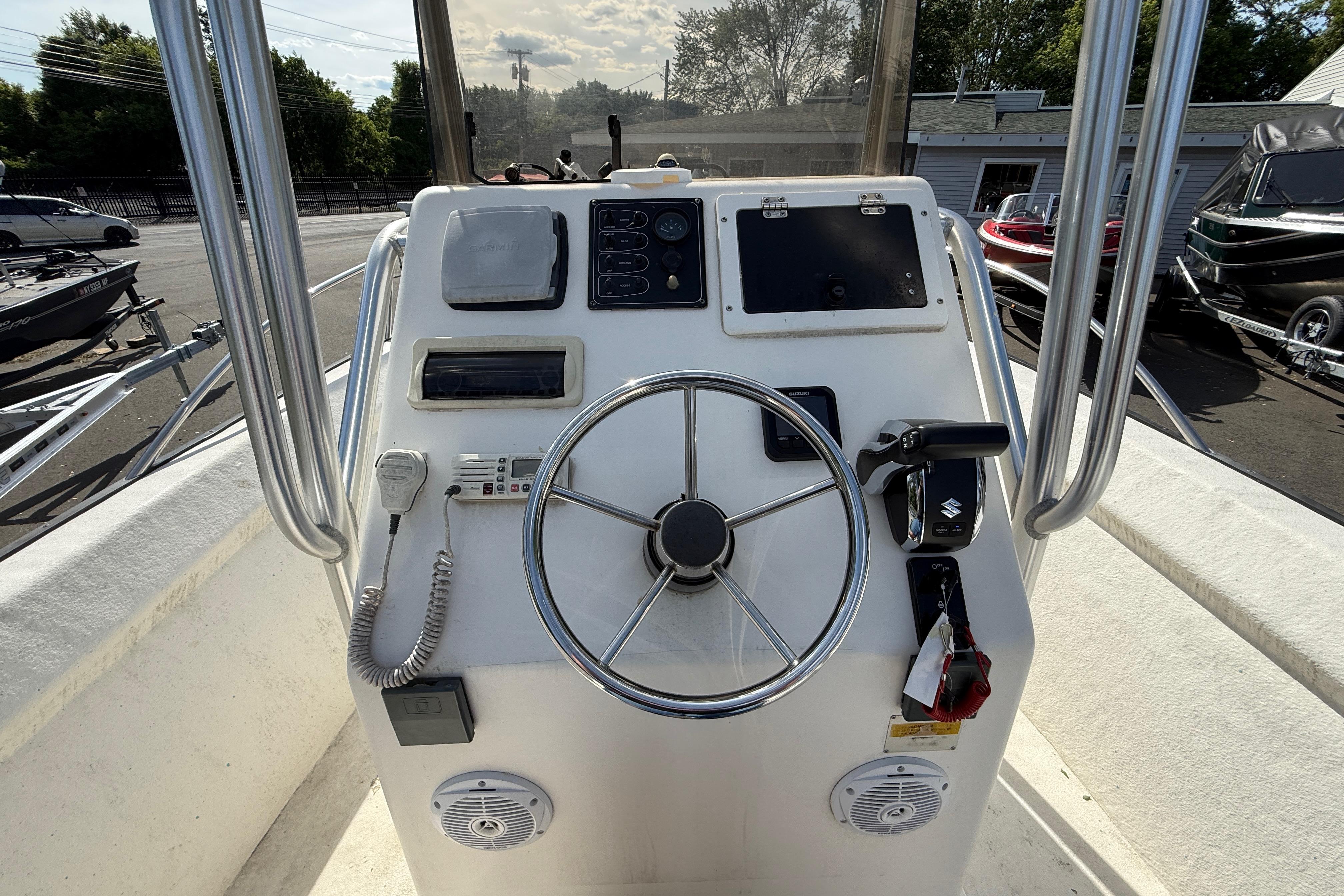 2008 Key Largo 206 Center Console boat dashboard with steering wheel and controls.