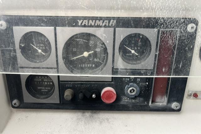 Control panel of a 2004 J Boats J/133 with Yanmar engine gauges.