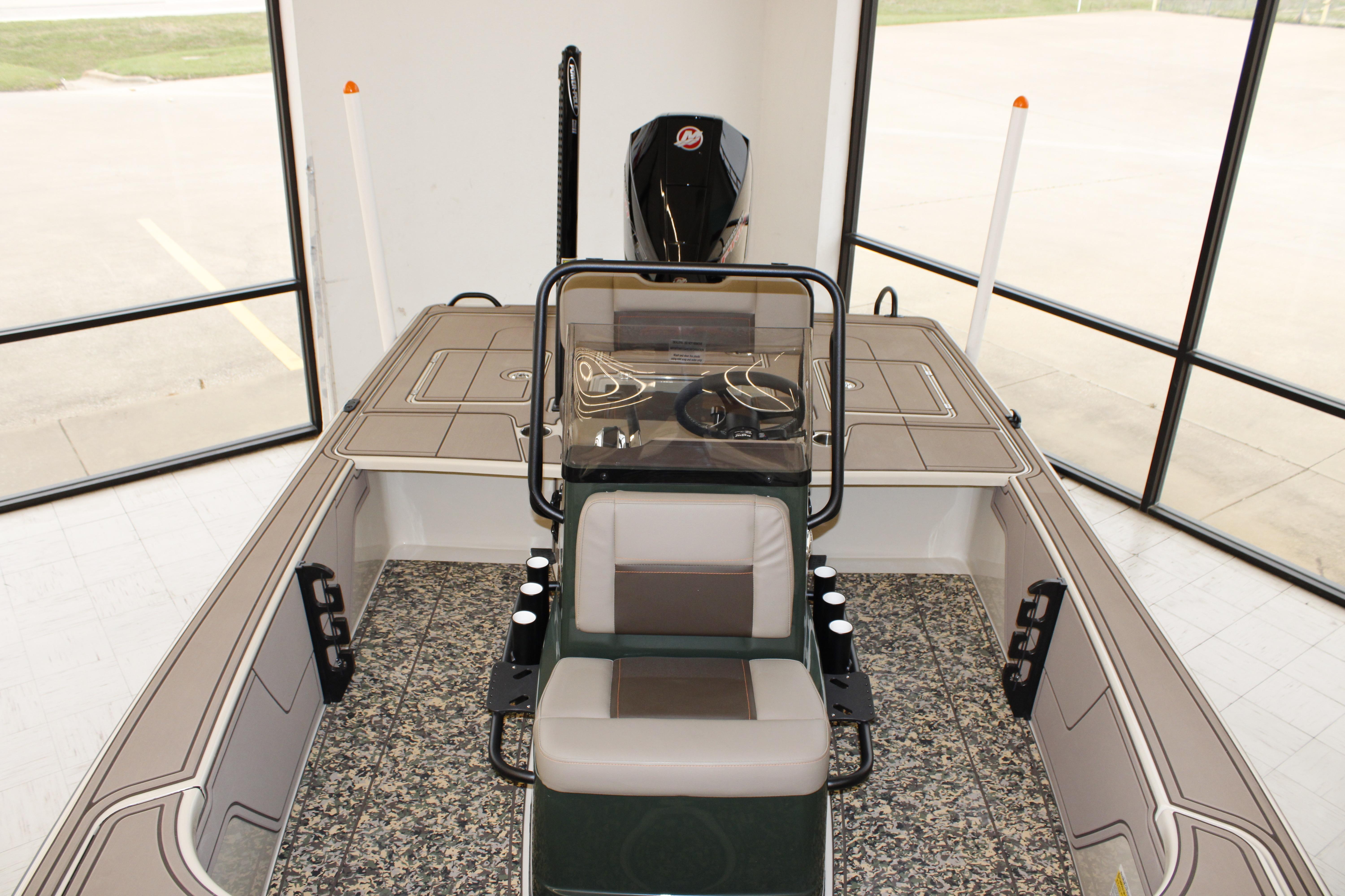 2026 Mako 18 Pro Skiff Backwater Edition interior with seating and steering console.