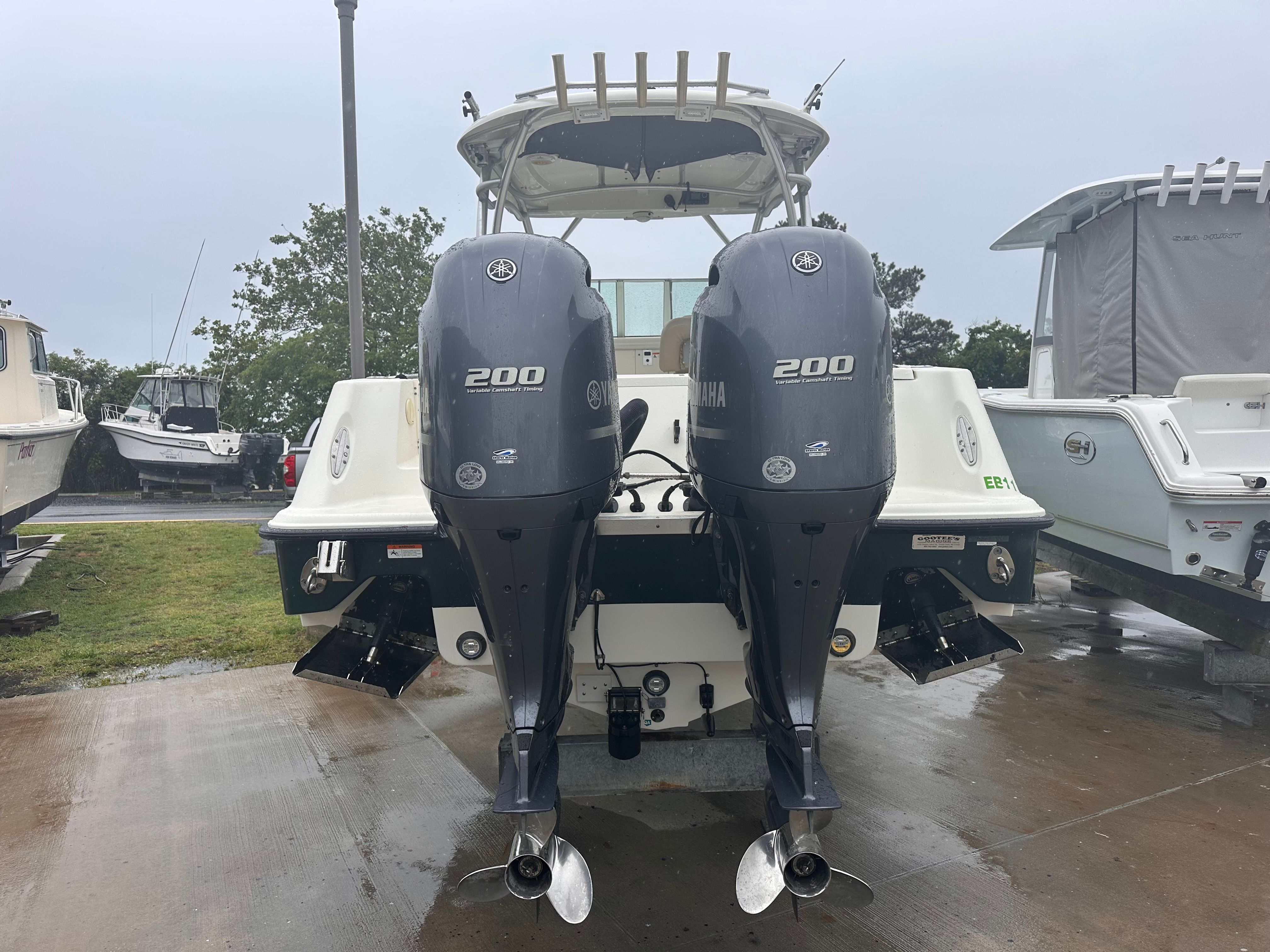 The image shows a 2023 Hydra-Sports Vector-VX boat with two outboard engines.