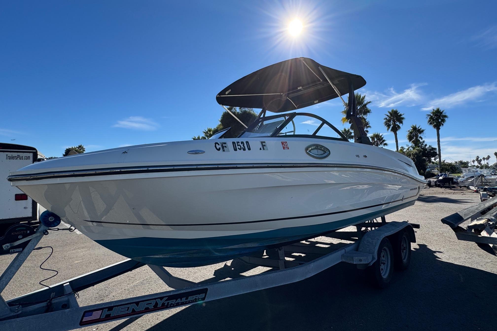 2022 Bayliner VR6 Bowrider OB on trailer under sunny sky.