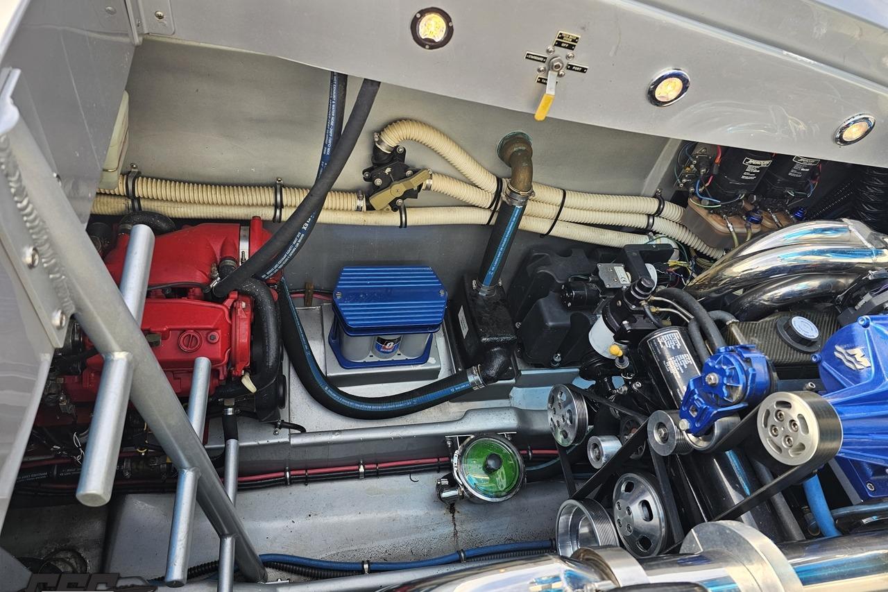 Engine compartment of a 2007 Hustler 41 Razor boat, showcasing mechanical components and wiring.