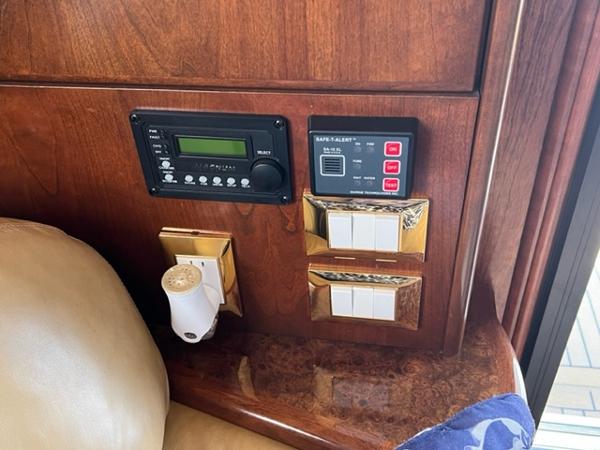 Control panel and switches in a 2009 Ovation 52 yacht interior.