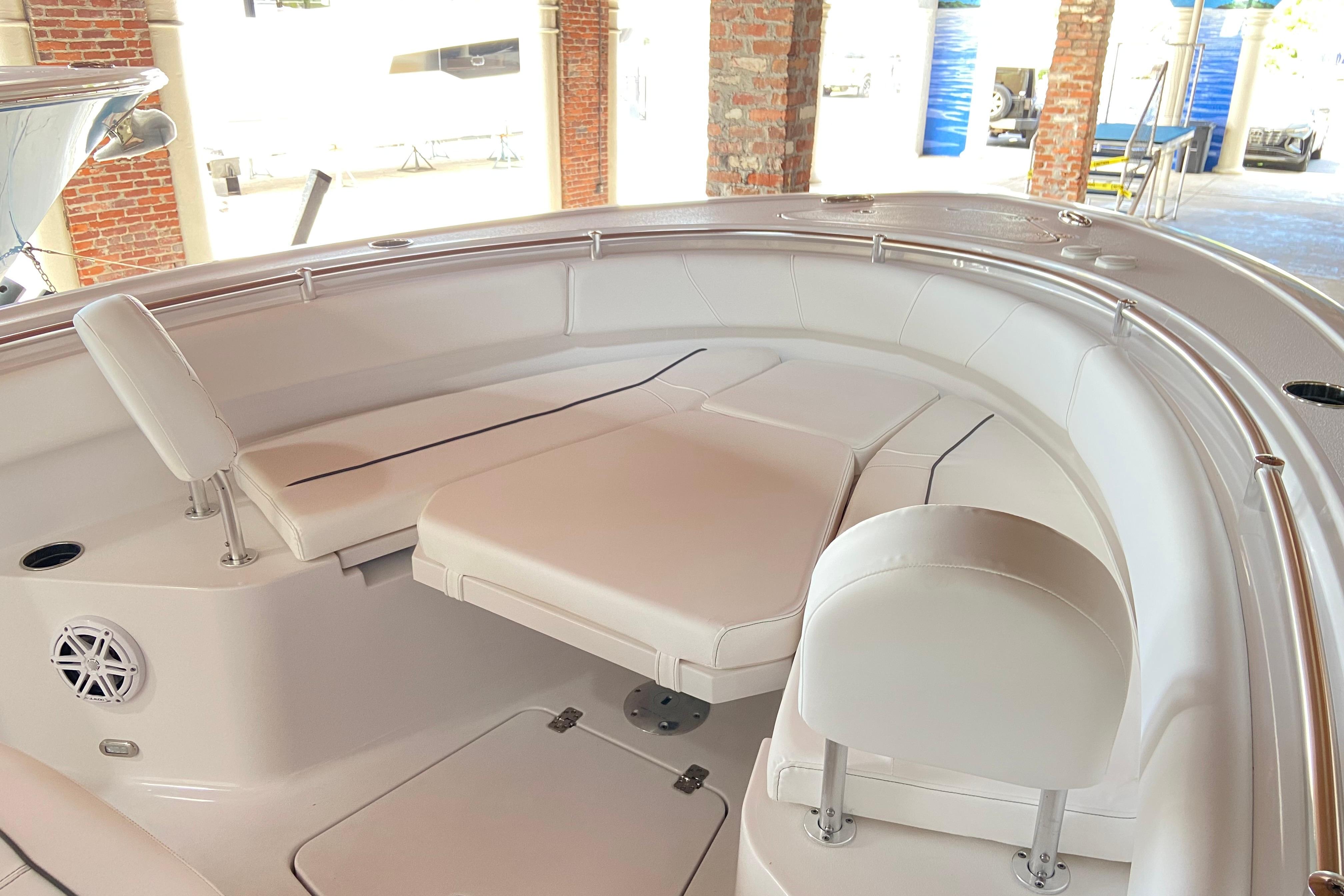 2026 Sportsman Open 232 Center Console boat interior with cushioned seating and sleek design.