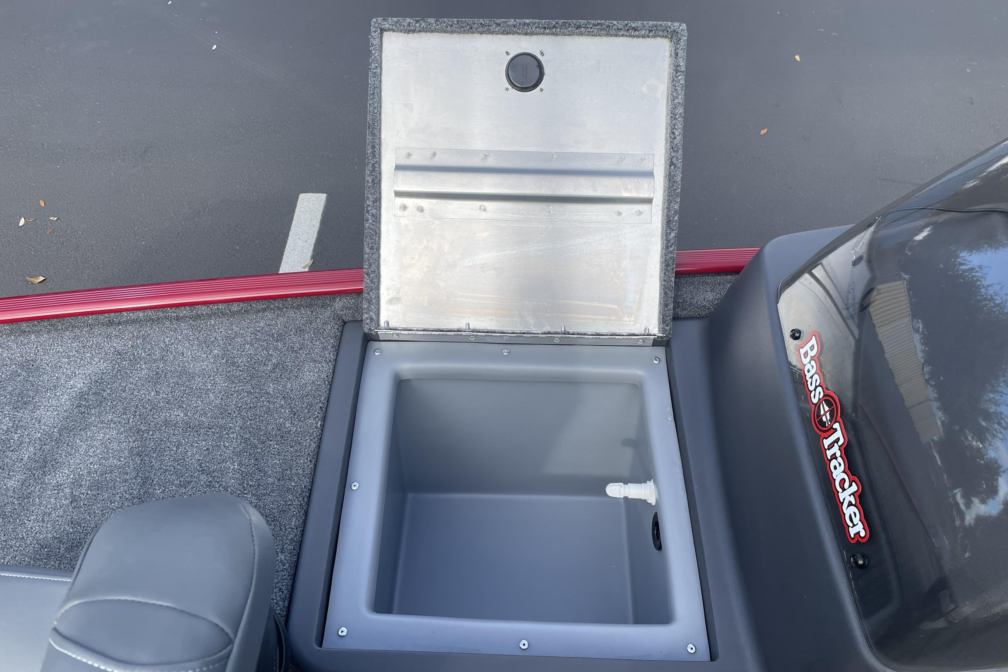 2026 Tracker Bass Tracker Classic XL boat storage compartment with open lid.