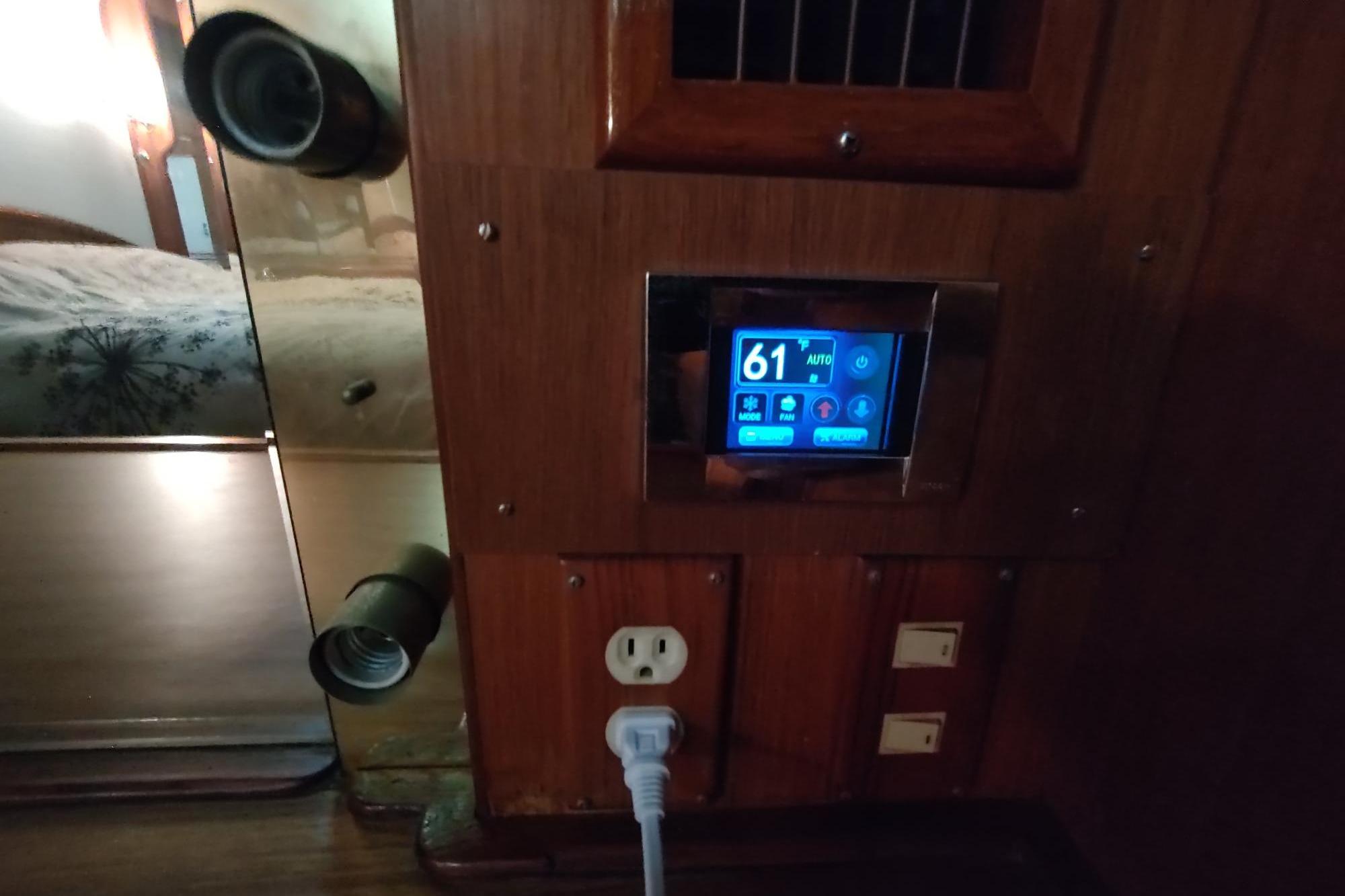 Interior of 1989 Hyatt Double Cabin Motoryacht with digital control panel and outlets.