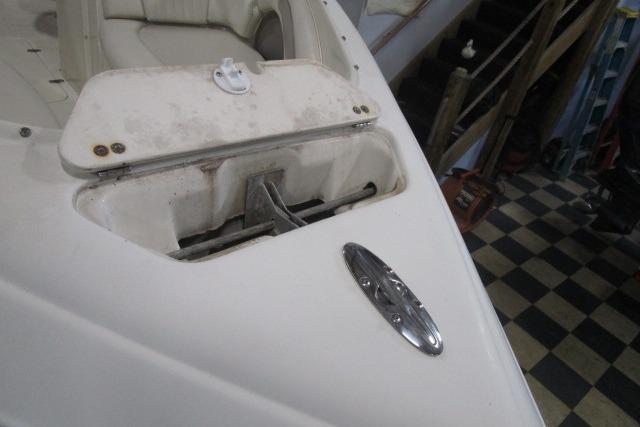 2004 Stingray 240 LR boat anchor compartment with checkered floor background.