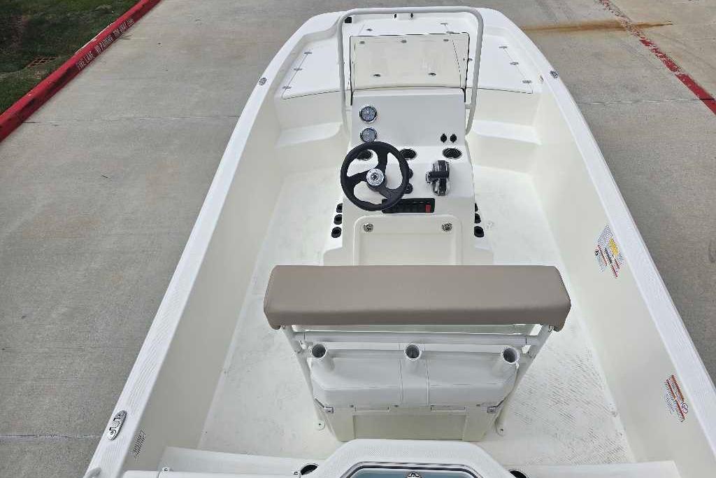 2026 Mako Pro Skiff 19 CC boat interior with steering console and seating.