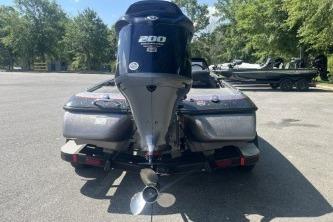 2014 Skeeter ZX200 boat with powerful engine, parked outdoors on a sunny day.