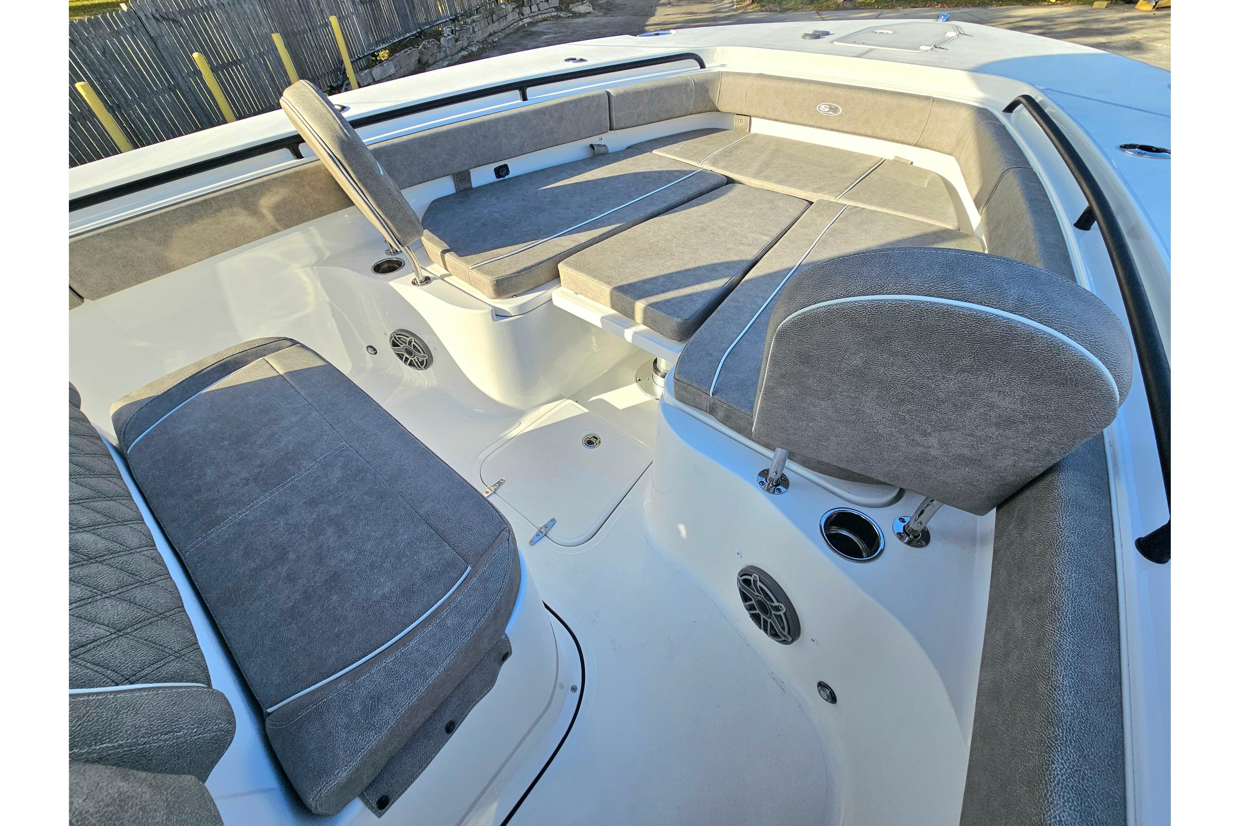 2026 Sea Hunt Ultra 285 SE boat interior with cushioned seating and speakers.